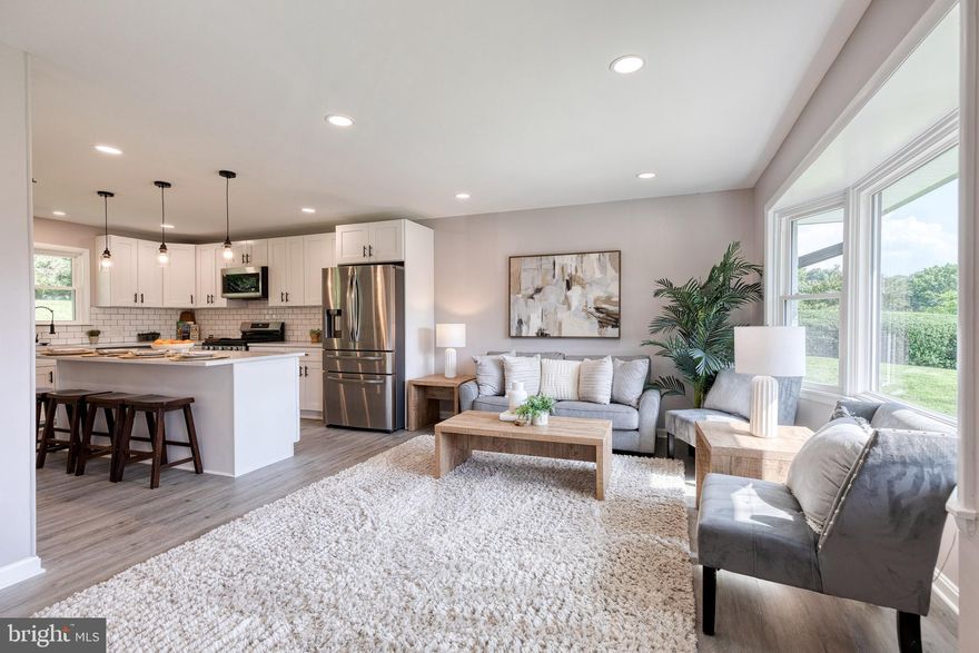 *** OFFER DEADLINE - MONDAY 7/28 at 5pm ***  WOW!  Stunning Newly Renovated, 4 Bedroom, 3 Full Bath, Rancher on over a Half Acre Lot!!!  Marriotts Ridge School District!  Modern Open Floor Plan that is perfect for entertaining.   Brand New Gourmet Luxury Kitchen with huge island, exotic quartz countertops, soft close cabinets, subway tile backsplash, stainless appliances, pendant lights.  Separate Open Dining Room.  Bathrooms with ceramic tile and built in inserts.  Primary Bathroom and Basement Bathroom have custom made seamless glass shower doors.  Huge fenced in rear yard. Almost Everything is Brand New!  Including: Kitchen, Bathrooms, Windows, Siding, Gutters, Flooring, Paint, Roof is only a few years old.  Move right in and don't have to worry about any updates...they're already made for you.  Available for quick settlement and move-in if needed.  Driveway was just seal coated, after the photos were taken.  Run, do not walk to this one!