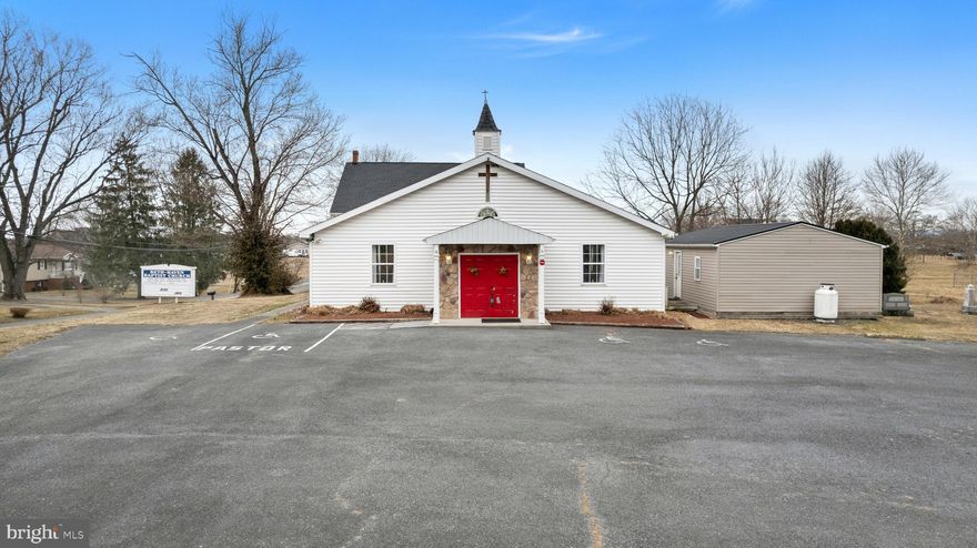 Exceptional opportunity to own a well-maintained turn-key church property in a peaceful, country setting just minutes from downtown Martinsburg. Situated on scenic Van Clevesville Road, Beth Haven Baptist Church offers a spacious sanctuary filled with natural light, ample seating capacity, and a welcoming atmosphere ideal for worship services, community gatherings, or special events. The sanctuary can hold up to 260 people and is outfitted with a vaulted ceiling, ceiling fans, 2 organs, 2 pianos, choir pews, a baptismal, and sound system. The property features multiple classrooms and meeting spaces, private offices, restrooms, and a fellowship hall perfect for receptions, meals, and ministry programs. The layout provides flexibility for a variety of uses including religious services, educational programs, community outreach, or potential adaptive reuse (subject to zoning approval).  Generous on-site parking ensures convenience for congregants and guests.  Dual zone HVAC, private well and septic. Kitchen is outfitted with 2 ovens, 2 microwaves, plenty of cabinets and supplies. Basement has windows and could be finished off for additional space. Whether you are an established congregation seeking a new home, a growing ministry in need of space, or an organization looking for a unique property with character and purpose, this location provides both accessibility and tranquility. Schedule your private tour today and explore the possibilities this special property has to offer. All personal property, supplies and furniture conveys with the property.