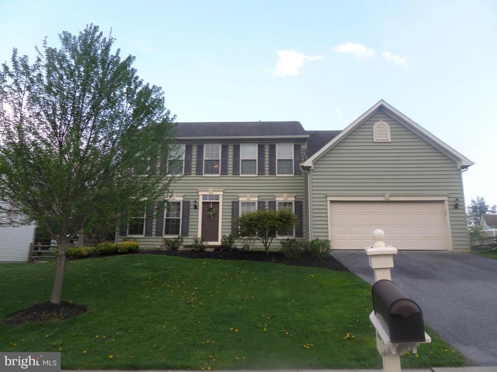 What a pretty home that is move in ready! The floor plan is open, spacious and bright. A two story foyer greets you with gleaming floors that are open to the living room and flow into the open two story family room. The room is flanked with a two story wall of windows and cozy gas fireplace. The family room is open to the kitchen that is well equipped with counter space,cabinets,island and desk area. There is a formal dinning room for your holiday entertaining. A laundry room is conveniently located off of the kitchen and is over sized. The master suit is amazing..windows, vaulted ceiling sitting room and pretty four piece on suite. There are two additional bedrooms and hall bath .What a comfortable home with flair. Now to the outside. This well landscaped and maintained home has a sprawli