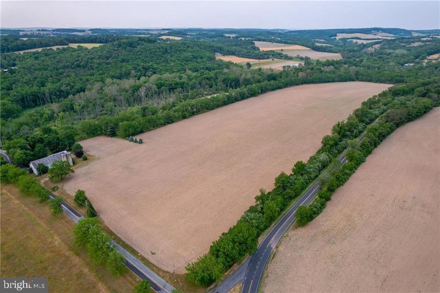 1800's Farmhouse & Development Opportunity with 117 Acres in Maxatawny Township. The home could be subdivided off & develop the remaining approx. 40 acres into 18- 1 acre building lots. Cleared farmland highlights the approx. 40 acres of developable land. Maxatawny Twp. has a 1 acre building lot minimum for this 117 acre parcel. Good road frontage on 3 sides to potentially have a through way street. Currently in Act-319 clean & green. Potential to also restore the farmhouse, barn & out buildings to their former glory, & make it your own private escape from the hustle of the city. Farmhouse has 1,920 SF, 3 BR, 1.5 BA plus large unfinished area in the attic & basement. Massive barn & out buildings in fair condition. Home needs some work but still holding onto good character & bones. Just 5 minutes from downtown restaurant & shops of Kutztown. 2 hrs. from NYC  & 90 min. from Philly. Call today for more information.