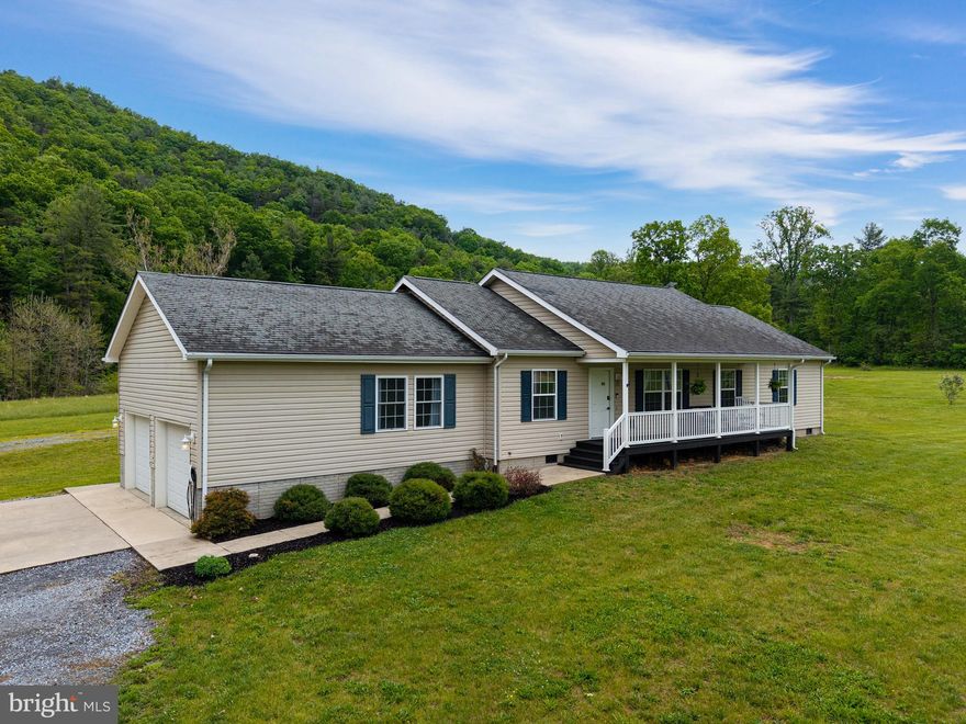 Rare opportunity to own a versatile horse property on 12.53 scenic acres in Luray. This spacious 5‑bedroom, 2‑bath home offers a flexible layout with a welcoming foyer well‑suited for office or dining use, along with a cozy living room ideal for gathering and relaxing. The home includes an existing flue, and a wood stove will convey with the property, offering the option for future installation.

The updated kitchen features white cabinetry, butcher block countertops, pantry, and utility room. Recent improvements include a kitchen remodel within the last five years, new bathroom countertops, and new laminate flooring throughout most of the home. The primary suite features built‑in storage, a walk‑in closet, and an ensuite bath with a spacious soaking tub and a separate stand‑up shower. The home also offers spacious secondary bedrooms, multiple closets, attic storage, and a large guest bath.

The land includes approximately 8 cleared acres and 4 wooded acres, highlighted by Dry Run Creek and a private pond. Equestrian amenities include a custom 48x60 barn with water and electric, multiple stalls, tack room, hay loft, chicken coop with fenced yard, an 80x150 level riding arena, and a site prepped for a round pen. Three 12x20 sheds (two built in 2021) include one shed with electric service and lighting and another prewired for future power. A welcoming front porch, rear deck, and garage/storage complete this well‑rounded country retreat.