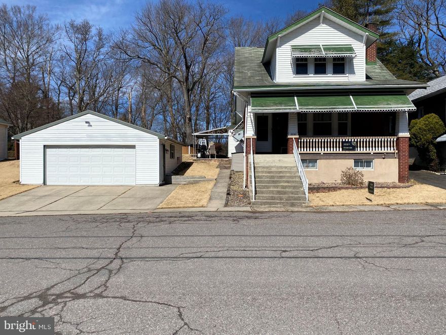 Say hello to your new dream home! This beautifully maintained Elk Ave single home is waiting for you! Pull your car into the 2 car garage & come in! The first floor greets you with a cozy living room that has a propane fireplace to help warm you on the upcoming cool Spring evenings. Enjoy cooking dinners in your beautiful kitchen with tons of cabinetry for storage, then dine in your formal dining room. Breakfast is served in the cozy breakfast nook off of the kitchen. You'll also enjoy the convenience of having a first floor laundry & half bath. Next, make the trip up the lovely wooden staircase to the second floor that boasts of a full bath & 3 nice sized bedrooms, one of which has the convenience of a half bath off of it. You'll love entertaining in your basement rec room that has a great seating area plus a bar! Outside, the entertaining heats up with an outdoor fireplace, horseshoe pits, & an above ground pool. And we can't forget the covered patio which will be great for summer dinners outside. If relaxing is more your vibe, then chill out on the large front porch. This home truly has it all! All it needs is you!