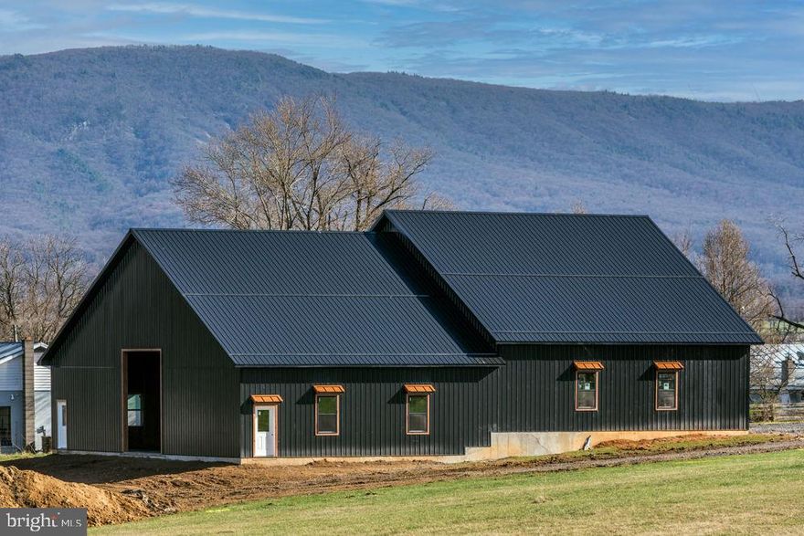 Imagine creating your dream farmette with mountain views and peaceful natural beauty. This unique property offers not just land—but possibility. A newly built 4,800 square foot shop sits on its own 2-acre parcel, thoughtfully designed with functionality and flexibility in mind,  featuring electric, two oversized 12’x14’ doors, an additional 12’x10’ door, soaring scissored trusses, and two roughed-in baths, it’s ready to serve as a workshop, equipment storage, or even a gathering place for family and friends. Both parcels zoned Residential Village with 2 septic approval sites and proposed well site. Build your dream home, create a hobby farm, or explore the potential for a small event or wedding venue. Set in a location with convenience, you’ll enjoy easy access to I-81 and Route 11, nearby dining and every day essentials, and just a short 10-minute drive to Harrisonburg. Major airports are within a two-hour reach, making travel simple while still enjoying the quiet charm of the countryside. If you’ve been searching for space, flexibility, and a setting that truly feels like home—this is your chance to bring that vision to life. Sold as is, where is.