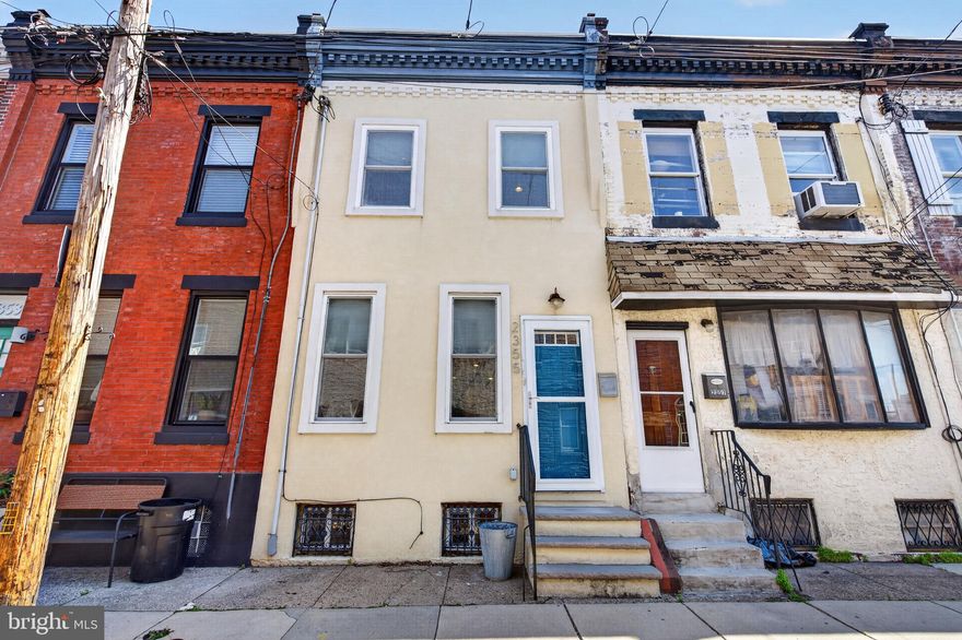 Welcome to this beautifully maintained Fishtown home set on a welcoming block. This warm and stylish residence effortlessly combines timeless character with thoughtful modern updates. Step inside to an open, sun-drenched main level where rich hardwood floors, elegant crown molding, and classic chair rail details create an inviting space perfect for everyday living and entertaining. The kitchen is truly the heart of the home, featuring eye-catching hex tile flooring, stainless steel appliances, cherry wood cabinetry, stone countertops, and a sleek glass tile backsplash. Just beyond, a private patio offers the perfect retreat for morning coffee or evening gatherings. Upstairs, you’ll find two well-sized bedrooms and two full bathrooms, including a peaceful primary suite complete with a built-in closet and en-suite bath. A finished basement with laundry, central air, and recessed lighting adds comfort and versatility to the home. Ideally located near I-95 and multiple public transit options, you’re just moments from everything Fishtown has to offer. This is city living at its best - schedule your showing today and experience it for yourself.