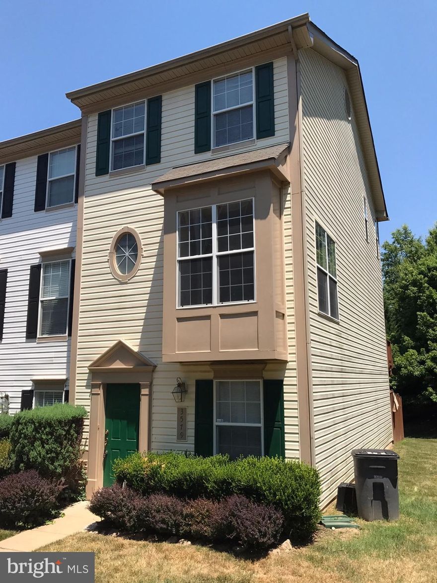 Ground floor entrance.  Ground floor features bedroom, rec room, and HWD floors with walkout to patio and fenced in yard.  2nd level includes FP, walk out to deck, and built in wine cooler.  2 assigned parking spaces.  Convenient for commuting.  Close to all Lake Ridge's ammenities.