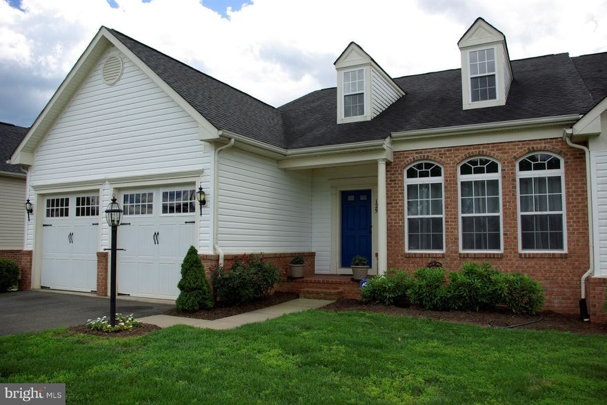 Beautiful and Spacious End Unit with everything you want in a home, Bright Open Floor plan with vaulted 2 story living room, sky light, large           windows, open to huge kitchen with custom High-end Birch cabinets installed by owner, Not            builder grade, soft close draws, glass front - very stylish, gas cooktop with extra high heat burner, double wall oven, large breakfast bar with a          breakfast room, lots of windows and French doors to the huge back deck w/ low maintenance Trex decking stairs to ground floor patio & yard,          Nicely landscaped w/roses & large trees, full         finished basement with full bedroom, half bath.  Much desired Master Bedroom on first floor       w/full bath, double sink, 2 Master walk-in closets.  Must see - ready for the new owner.