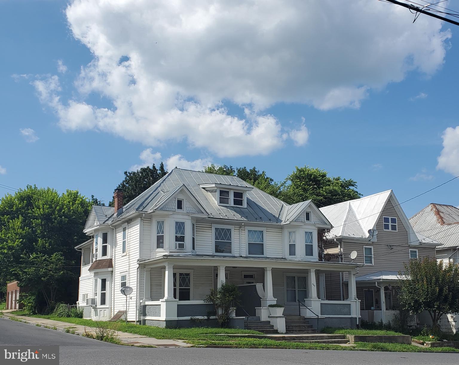 BACK ON THE MARKET - NO FAULT OF THE SELLER - BE THE LANDLORD - as the owner of this duplex !! 449 side consist of 3 bedrooms & 1 1/2 Baths, New Flooring with 4 New Window A/C Units, New Stove & Microwave . 451 side consist of 3 Bedroom & 1 Bath w 4 New Window A/C Units, New Flooring on Main Level , Built in Cupboard in Spacious Dining Room. Both Units Have Rear Fenced Yards, Covered Front Poirch, Covered Upper level Side Porch, Staired access to attic & also you have a basement for storage . Room Measurements are included with Docs. Spacious Rooms offers Charm & Character - Much of the original woodwork & architectual featurees have been preserved . Rent both sides or Live in one side & let the Tenant help make your mortgage payment. Easy to show.