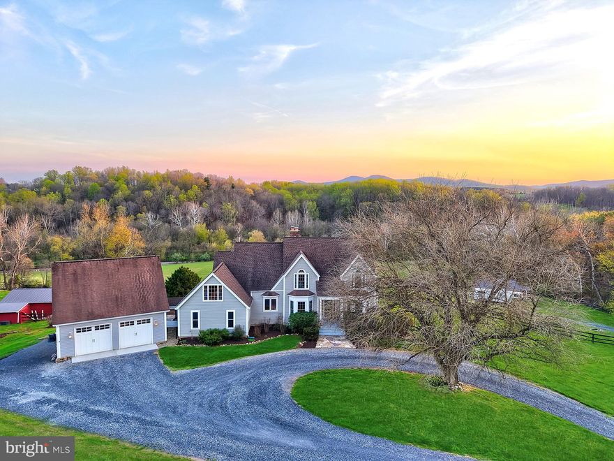 Welcome to an extraordinary private estate set on over 25 acres of scenic countryside, where refined living meets the beauty of open farmland. A picturesque, tree-lined drive and gravel approach create a grand sense of arrival, offering both privacy and timeless elegance.


Inside, a stunning foyer welcomes you with rich wood flooring, setting the stage for the sophisticated interiors that follow. Designed with both luxury and comfort in mind, the home offers expansive living spaces ideal for entertaining and everyday living alike.


The kitchen features stainless steel appliances, granite countertops and wood cabinetry, with windows that highlight the plush landscape, perfect for gathering and hosting with ease.


Thoughtfully designed spaces flow seamlessly throughout the home, including a dedicated media room—perfect for cinematic experiences in the comfort of your own residence.


Each bedroom serves as a private sanctuary, enhanced by distinctive features such as cozy fireplaces, serene balconies, and spacious walk-in closets, delivering a true retreat-like experience. The owner's suite has a custom California Closet System in the oversized closet.


The fully finished basement introduces a private, self-contained living area complete with its own kitchen and laundry room, along with custom flagstone flooring sourced from the property itself. and a steam shower. This versatile space is ideal for extended family, guests, or potential income-producing opportunities, all while maintaining a high level of comfort and privacy.


Step outside to discover resort-style living at its finest. An expansive deck overlooks the beautifully maintained grounds, while the recently serviced pool and charming gazebo provide the perfect backdrop for elegant outdoor entertaining or quiet relaxation.


Additional amenities include a detached two-car garage and a state-of-the-art 25KW in-ground solar system, valued at approximately $100,000 and fully conveying with the property—offering both sustainability and impressively low electric costs.

With over 25 acres of versatile farmland, this estate presents a rare opportunity to embrace a lifestyle of luxury, privacy, and possibility—whether for equestrian pursuits, agriculture, or simply enjoying the tranquility of your own expansive retreat.

This is more than a home—it is a legacy property.