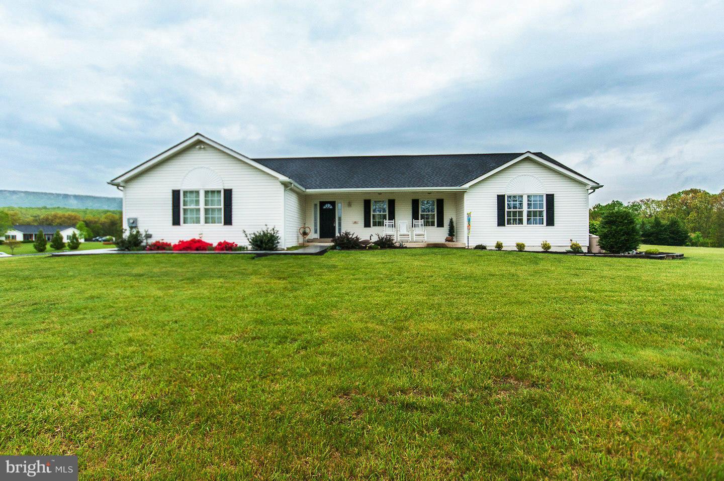 One level living in this well cared for rancher on 2 open AC. Features 3 BR, 2 BA, LR, DR, & Laundry all on the main level. Additional living quarters in finished bsmt. w/ family room, kitchenette, dining area, BA, + room currently used as a 4th BR (no window) but would make a great office. Front porch, back deck, garden space & 2 car attached garage. Wall of built-in cabinets & 2 storage rooms.