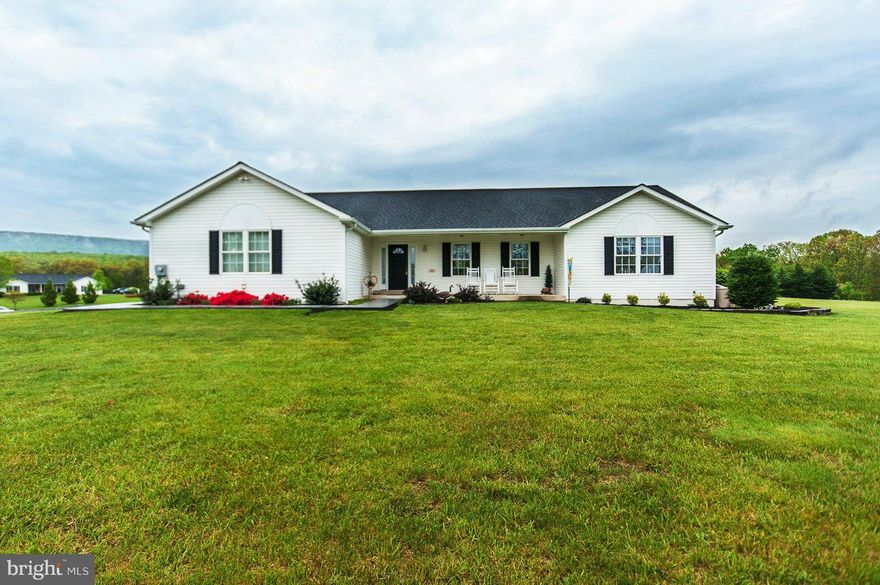 One level living in this well cared for rancher on 2 open AC. Features 3 BR, 2 BA, LR, DR, & Laundry all on the main level.  Additional living quarters in finished bsmt. w/ family room, kitchenette, dining area, BA, + room currently used as a 4th BR (no window) but would make a great office. Front porch, back deck, garden space & 2 car attached garage.  Wall of built-in cabinets & 2 storage rooms.