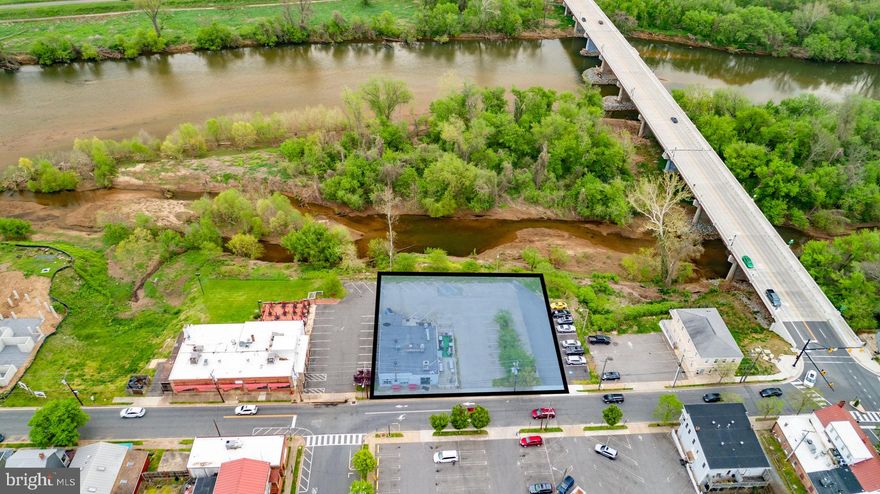 Welcome to 1009 & 1017 Sophia Street, a unique opportunity to own two parcels totaling .51 acres of prime waterfront property in the heart of Fredericksburg's historic district. Nestled in the vibrant downtown district of Fredericksburg, this property boasts water frontage on the Rappahannock River. The 2,840 square foot building is currently leased to The Pig Pitt restaurant, with the lease valid until 2/28/26, ensuring immediate rental income for the new owner. Additionally, a parking lot is leased to the City of Fredericksburg for use as a public parking lot on a month-to-month basis, with this lease also conveying with the sale. The CD (Commercial Downtown) zoning allows for the flexibility of the buyer to redevelop the property into various commercial, residential or mixed-use options by-right, maximizing the potential of this prime location. This is a rare opportunity to invest in a piece of Fredericksburg's rich history while enjoying the benefits of a waterfront property in a bustling downtown setting. Whether you're looking to continue leasing to established tenants, redevelop the property, or create a new waterfront venture, the possibilities are endless. Don't miss out on this exceptional investment opportunity in one of Virginia's most charming and historic towns.