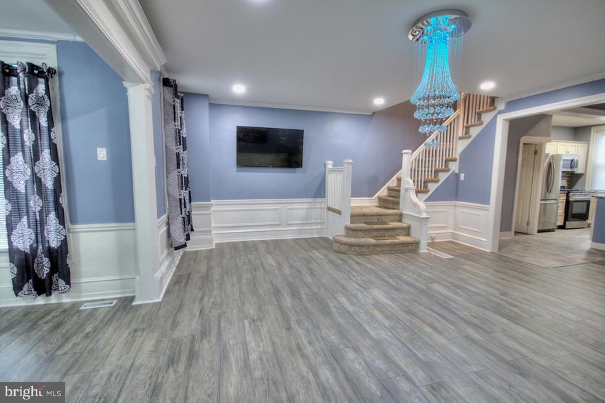 Do you believe in love at first sight? Well you will once you step foot into this completely renovated home situated in the Fern Rock section of Philadelphia. Welcome to 5743 N 13th Street.  Step foot inside this beauty and take notice of the gleaming wood floors that run through the entire first level. The open floor concept will surely have the designer in you working overtime. With more room than you could ever imagine, the main level is a crowd pleaser. The eat in gourmet kitchen features all new appliances and enough gleaming granite to satisfy even the most discerning chef. The top floor features four oversized bedrooms and newly renovated hall bathroom. The basement is finished and provides additional living space along with a full bathroom for added convenience. To finish off the basement be sure to check out the large laundry with washer and dryer. Garage parking and drive-way parking also included! Be sure to schedule today because this home will be gone tomorrow!