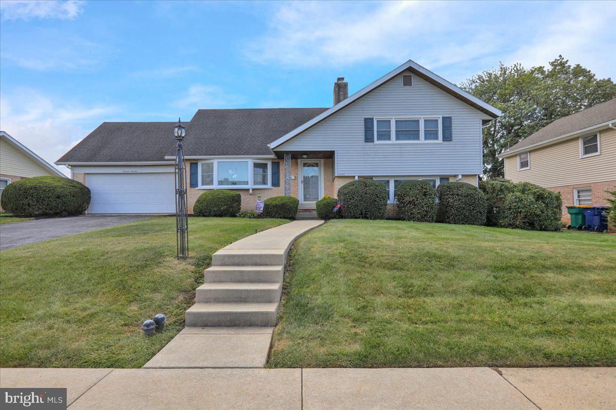 Looking for a home in Whitfield, this 4 bedroom, 3 full bathroom split level is ready for quick possession! Situated on a 0.19 acre private, level lot, the interior of this well maintained home offers 2,100 + square feet of finished living space. The main floor has a semi open floor plan with living room, dining room and kitchen plus access to the large, partially covered deck overlooking the back yard. A few steps down, you will find the family room with wood-burning fireplace, a full bathroom and the laundry room. A few steps up from the main level and you will find 3 secondary bedrooms and a full bathroom. Lastly, the second upper level hosts the primary bedroom with skylight, 2 closets and its own full bathroom. A 2-car garage as well as an unfinished basement hosting all your mechanicals along with offering plenty of storage space and the convenient location with easy access to major routes, shopping, restaurants, schools are just a few more highlights to mention. Don't miss the opportunity to own this beautiful home within the Wilson School District!