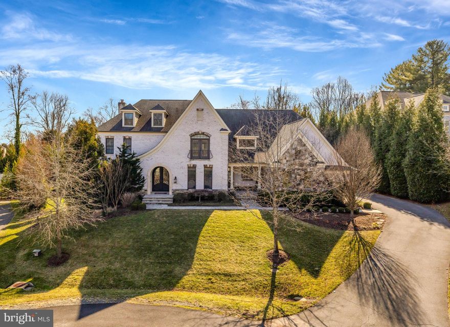 This stunning French Provincial custom home spans 6,112 sq. ft. and is designed with both elegance and functionality in mind. Featuring 5 spacious bedrooms and 5 1/2 luxurious bathrooms, this home offers the perfect blend of comfort and sophistication. The heart of the home is the expansive chef’s kitchen, equipped with a 60-inch Wolf range, dual islands, and a full catering kitchen, ideal for entertaining. The light-filled family room showcases a wall of glass doors, a beautiful stone fireplace, and reclaimed wood beam ceilings. Step outside to your own private oasis, complete with a sparkling pool with waterfall feature, travertine hardscaping, and a firepit for relaxing evenings. Additional highlights include a 4-car garage and meticulous millwork throughout, making this home the perfect re-treat for those seeking both style and convenience.