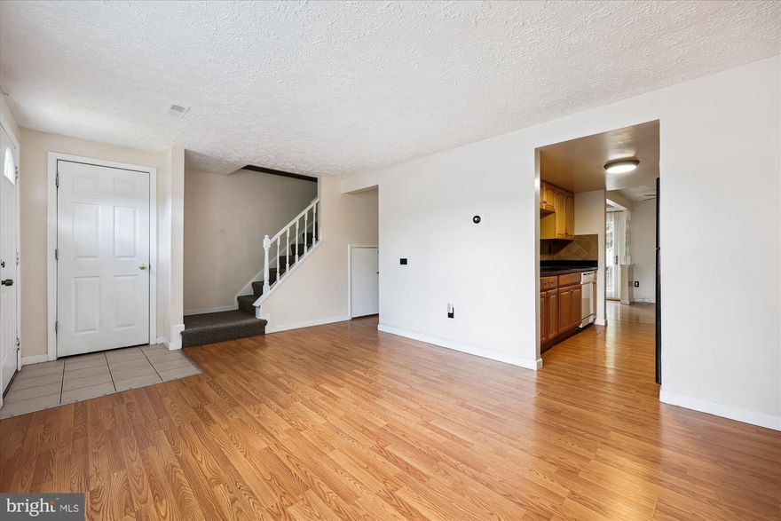 Move-in ready and designed for easy living! This well-maintained home features low-maintenance laminate flooring throughout the main areas, with carpet on the stairs. The kitchen is equipped with brand-new oven and range hood (both installed August 2025), stylish granite countertops, and a layout that opens seamlessly to both the living and family rooms—ideal for everyday living and entertaining. The spacious family room leads to a fully fenced backyard, offering privacy and the perfect space for gatherings. Enjoy the convenience of a main-level laundry area with updated washer and dryer (2022), as well as a newer HVAC system (2022). Upstairs, you’ll find three generously sized bedrooms and two full bathrooms, including a private en-suite in the primary bedroom. Tech upgrades include a Ring Doorbell and Nest Thermostat. This home also comes with two reserved parking spaces and access to visitor parking. Unbeatable location! Just minutes from public transportation, Montgomery College, shopping centers, restaurants, cafes, parks, trails, I-270, and Holy Cross Hospital. A perfect combination of comfort, convenience, and value.