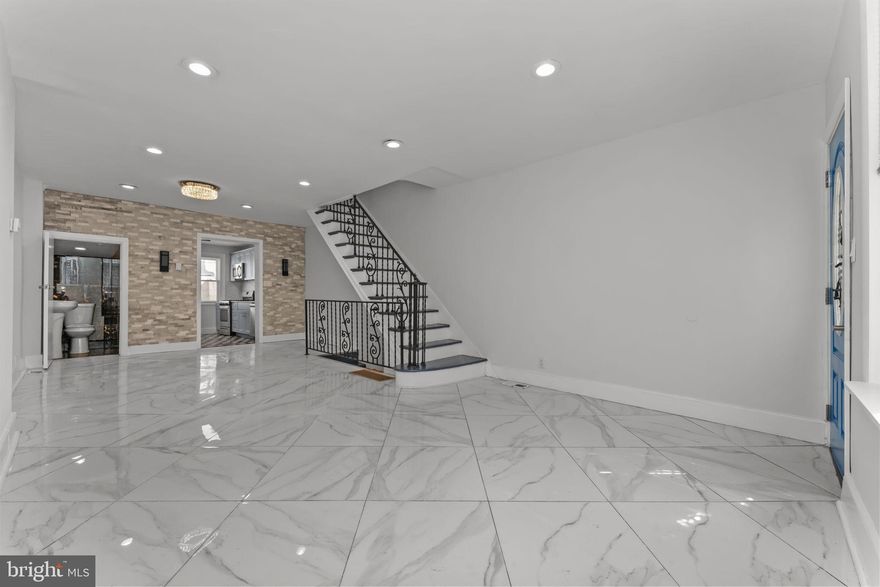 LOCATION LOCATION LOCATION!!!!Welcome to the newly updated Home in the Desirable Neighborhood of  South Philadelphia. Walk in to a beautiful open concept floor plan. Beautiful 30"x 30" Ceramic Tile flooring in the main floor, and plenty of natural light. Large living room leads you to your dining . Your beautiful Kitchen features gray shakers cabinets, Granite Countertop and beautiful backsplash, stainless steel appliances is ready for all your family, holidays, and any events meals. From the kitchen you will exit to your backyard which will be great for all your outdoor entertainment. A partial bathroom is conveniently located on the main floor. Up on the second floor you will find your large size bedroom with a closet and plenty of natural light. Your 2 guests bedrooms is down the hall. and a nice balcony is a great bonus to have.  Your hallway bathroom with a great choice of ceramic tile encased bathtub, and around the entire walls, modern vanity. Your finished basement will be great for a young adult who would like their own space, and definitely for a games and entertainment . Your Washer and Dryer is located in your basement. Schedule your showing Today!!!!