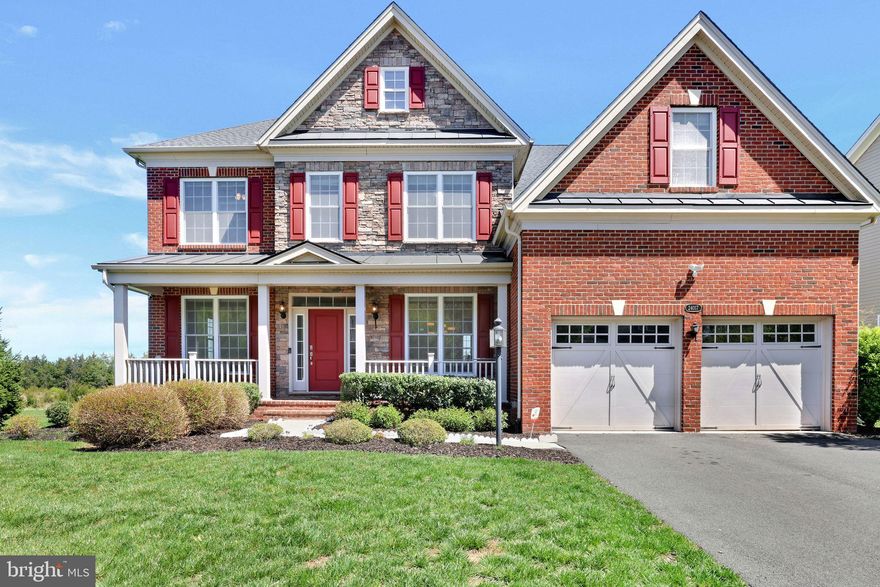 (WEST FACING) Rarely Available! Step into a storybook home where timeless elegance meets modern ease. A charming covered porch welcomes you into warm hardwood floors, detailed moldings, and sunlit spaces thoughtfully designed for both work and relaxation.

The main level features a private office, a smartly placed mudroom, and a cozy family room with a gas fireplace that flows seamlessly into a chef-inspired kitchen, complete with a spacious island, stainless steel appliances, and access to a stunning end-unit wooded lot offering endless privacy. Just off the kitchen, a bright sunroom invites slow mornings and golden hour gatherings.

Upstairs, the primary suite is a true retreat, boasting a spa-style bath with a standing shower and deep soaking tub. Three additional bedrooms offer generous space and thoughtful layouts, including one en-suite and a Jack & Jill bathroom. A full laundry room adds everyday convenience.The walkout lower level is your personal escape, featuring a spacious rec room, and a full bar.

Brand-new carpet throughout and freshly painted in 2025!

Located in the coveted Lenah Mill community, enjoy resort-style amenities including pools, a clubhouse, fitness center, trails, sports courts, a dog park, and more—set within over 300 acres of preserved green space in scenic Loudoun wine country.
Moments from dining, shopping, Dulles Airport, and the Silver Line, this is luxury living with the perfect blend of serenity and accessibility.