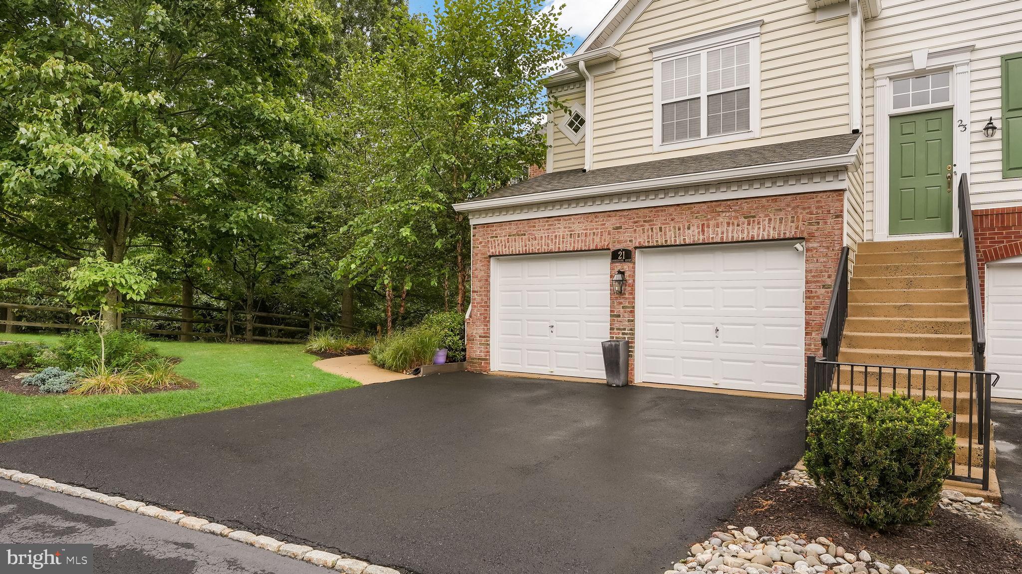 Meticulously Maintained END UNIT Townhome now available in desirable Doylestown Station! This 3 Bedroom/3.5 Home features sophisticated finishes and thoughtful upgrades. From the moment you arrive, the curb appeal is undeniable--graceful White Birches and professionally landscaped plantings. Enter into the Light-filled Foyer with Gleaming Hardwood Floors and classic Turned Staircase. The Living Room features a Triple Window with Plantation Shutters and is open to the Gracious Dining Room with box molding and designer grass cloth Wallpaper. The Dining Room is perfect for entertaining and is OPEN to the Gourmet Kitchen--so the Chef can be part of the conversation! The Kitchen is a "showpiece" featuring Granite counters, Premium Fisher-Paykel Stainless Appliances, Island with Butcher Block Counter, Floating Shelves, a Granite Coffee Bar and Pantry. The OPEN Layout continues into the Dramatic Two-Story Family Room highlighted by a Marble-Surround Gas Fireplace. Step out to your Private Deck with Retractable Awning and enjoy the solitude of the trees--a quiet retreat at home. An elegant Powder Room and Updated Laundry/Mudroom complete the Downstairs. Upstairs, the Luxurious Primary Suite features a Tray Ceiling with a Triple Window, Full Bath with Soaking Tub, Frameless Glass Shower and Marble Vanity with Double Sinks plus a Walk-in Closet with Custom Closet System. The Versatile Second Bedroom is right next to the Primary Suite and is currently being used as an Office. A Charming Landing/LOFT space with an OVERLOOK into the Family Room connects you to the SECOND Bedroom "Suite". This Bedroom features it's own En-Suite Updated Full Bath, a Walk-in Closet, a Linen Closet and a Sweet Diamond-Shaped Window. The FULL FINISHED Basement features an EXTRA Floor of Living Space. Entertain in your Custom Granite Bar with Bar Sink, Huge Mirror, Cabinetry and Stools for 4 people. There is also an open gathering area for Fall get-togethers. A "BONUS" Room can be used as a Bedroom/Office/Workout Room that is conveniently connected to another FULL Bath. Ample storage is available in the Utility Room. You even have the comfort of a Generator for the home! The Oversized TWO CAR Garage is immaculate with an Epoxy Floor, Laundry Tub, Extra Shelving and a Refrigerator. Enjoy a low-maintenance Lifestyle with the HOA taking care of exterior upkeep, lawn care, snow removal, and trash service. Stroll the path to Central Park, Kid's Castle playground,—or take a 5-minute drive into Historic Doylestown Borough for dining, boutiques, and cultural experiences. Make this your new home—where EVERY detail has been thoughtfully curated, creating a space that is updated and refined! **Showings begin on 9/11/2025. There is an OPEN HOUSE on 9/14 from 1:00 p.m.-3:30 p.m.