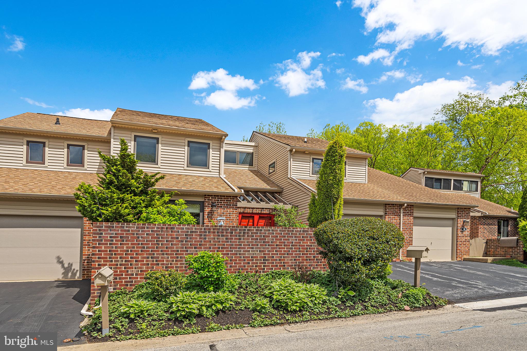 This charming townhome has many top quaiity upgrades throughout.   Charming, belgian  brick walled courtyard, with lush perennial landscaping and sliders in to kitchen.   Two story Center Foyer with re-built wooden staircase.  Gourmet gutted Kitchen wih quartz countertops, huge Center Island with deep stainless sink-abundance of white cabinetry, pantry,  built-in  bench with cabinetry below,  breakfast area, sliders to courtyard,  GE   Profile stainless steel appliances, microwave/convection oven.  One of the nicest kitchens I have ever seen!  Formal Dining Room with sliders to deck.  Living Room with fireplace.  Family Room with  view of fireplace and sliders to deck.  Primary Bedroom with gutted Bath, walk-in and shelved closets.  Updated Hall Bath.  Laundry.  2nd & 3rd Bedrooms.  
Lower Level with spacious Bedroom  with slider to patio and Recreation with slider to 2nd patio.  Separate entrances.  Two storage rooms.   Area behind bedroom may have potential to be a 3rd bathroom.     
Fresh neutral decor.   Bright & Light!  A lot of space behind this property between  homes behind with beautiful trees including a blooming mature dogwood.  Extensive list of top-of-the-line upgrades included.  Award winning Tredyffrin Schools.  Walking distance to Wilson Park, shops, and walking trails through Valley Forge Park.   Convenient to any kind of shopping and restaurants.  Community pool-for extra fee.  One of my most favorite listings!  Settlement negotiable after May 11.