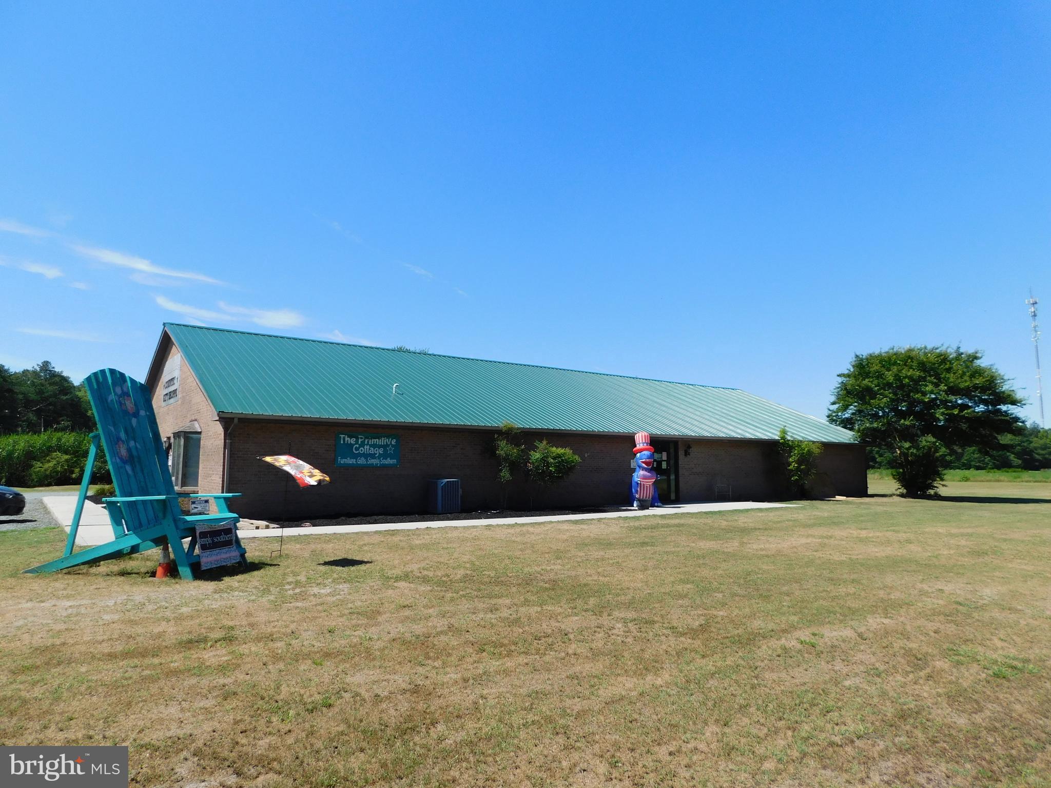 Location, Location, Location! Don't miss this opportunity for your chance to own just under 2 acres with 470ft. of direct highway frontage on east bound Rt. 50 minutes from the beach. This multiuse commercial building is currently being used as a thriving boutique and tanning salon which can be purchased at an additional cost. There are three separate units that are currently being used as one large space they all have separate HVAC, separate entrances and bathrooms. Bring your current business or your imagination for a startup business and place it in front of direct beach traffic. This attractive brick building has a newer metal roof and is sure to catch anyone's eye. Seller is motivated and ready to entertain your offers. The possibilities are endless. don't let this one slip away from you.