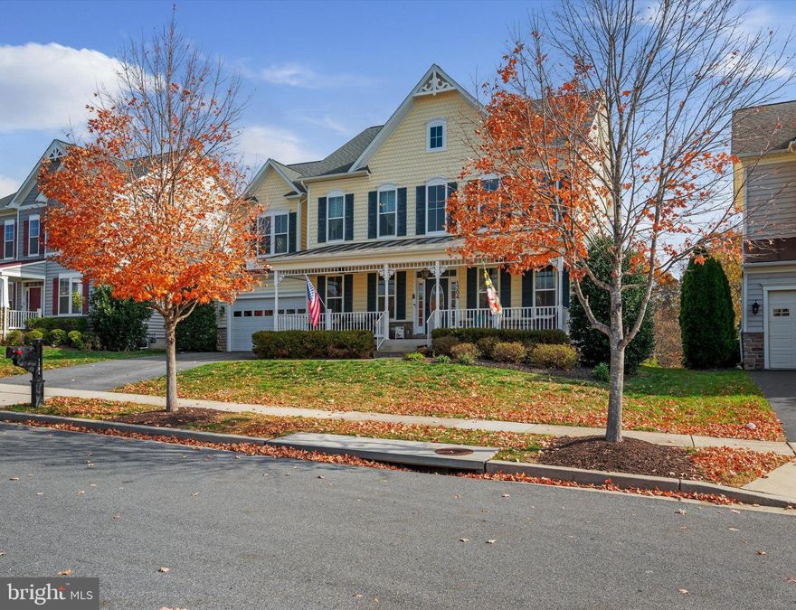 Walking Distance to Swimming Pool and Club House!  This extraordinary 4 bedroom, 3.5 bath home with all the bells and whistles is located in sought-after Brunswick Crossing! The main level features a family room off the kitchen with a natural gas fireplace and gorgeous hearth. The large eat-in kitchen with a breakfast bar, granite counters and premium stainless-steel appliances, including a 5-burner natural gas stove and double oven. Hardwood floors flow throughout this entire level. A separate breakfast room and double-doored office/playroom/craft room are off the kitchen. This level also has a formal dining room and a formal living room. The basement has a large rec room with surround sound, which provides loads of extra square footage. Upstairs, the primary bedroom with tray ceiling has an attached sitting/dressing room, tray ceilings, dual closets, and ensuite bath with an oversized shower with bench and soaking tub. The second primary bedroom (or "Princess Suite") has a large closet and ensuite bath. The other two bedrooms are well-sized and share a Jack-and-Jill bathroom with a separate water closet. Convenient bedroom level laundry room with built-ins. Outside, the backyard with patio and fire pit backs to a forest conservation area with a stream for privacy and the front porch overlooks the neighborhood gazebo, so you can socialize with the community. All this within a neighborhood loaded with amenities- pool, gym, sand volleyball courts, 10+ playgrounds, splash pad, soccer field, and more!