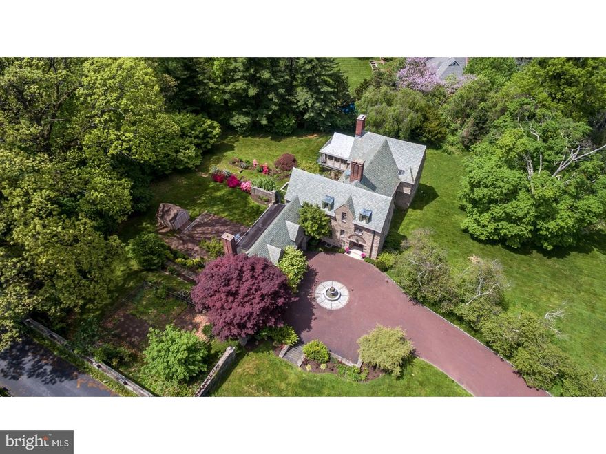 Here's your chance to live on the most sought after street in all of Wyndmoor! This magnificent manor home was designed by well known Philadelphia architect Frank Rushmore Watson in 1924. The gracious entry hall with gorgeous tile floor leads you to the step down living room with stained glass window, fireplace and hardwood floors. The family room is off of the living room and has fireplace and gorgeous views of the grounds. The formal dining room has wood floors, fireplace, large windows and is perfect for hosting holiday dinners. The kitchen has custom wood cabinets and moldings, tray ceiling, granite counters, built in steamer and Wolf and Sub Zero appliances. There is a sunny breakfast room with doors to patio. The laundry/mud room is conveniently located off of the kitchen. The second floor has 3/4 bedrooms and 3 full baths. The master suite features vaulted ceiling, gas fireplace and french doors that open to a  Juliette balcony.  The master bath is beautiful and has been totally redone with large soaking tub, stall shower, heated towel bar and leads to private dressing area  with walk in closets. A coffee bar and spacious office make this a perfect master retreat. Two additional bedrooms with en suite baths and exercise room complete the second floor. The third floor is perfect for weekend guests! There are two bedrooms, large playroom full bathroom and cedar closet. But wait there's more!! An attached carriage house with private entrance is the perfect spot for for in-laws or Au Pair suite and is also accessible from the main house. The basement is unfinished but offers wine cellar and plenty of storage. A state of the art Buderus heating system is super efficient. This gem of a home offers you the feel of a country estate but is minutes to Chestnut Hill, shopping, dinning, transportation and the best schools in the area.