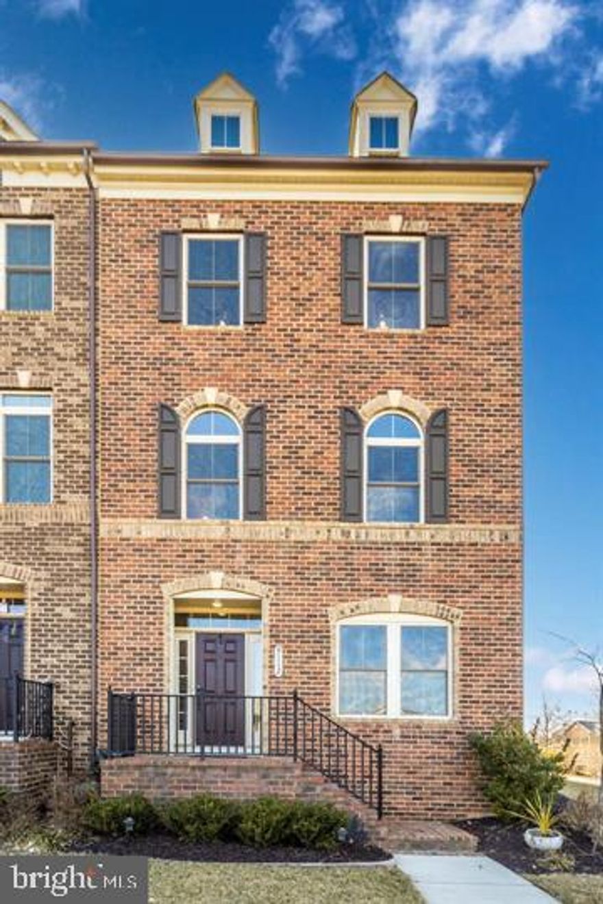 For rent! This remarkable end-unit townhouse in sought-after Villages of Urbana has everything you could dream of in your next home. Why wait for new construction? Fresh paint and new carpet make this home feel brand new! Larger than many single family homes, this townhouse has over 2,700sf of space for you to live, relax, and enjoy. With so many working remote, the entry level is equipped with beautiful french doors leading to a bonus room that can be used for a private home office. You will love spending time and entertaining in your expansive gourmet kitchen with double wall ovens/Advantium microwave convection oven, stainless steel appliances and range hood, and a statement-sized granite island for everyone to gather at and relish. Adorned with hardwoods, the large main level open-floor concept allows you to engage with your family and friends whether they are in the kitchen or family room. As the weather warms, spending time on your low-maintenance composite deck will be a favorite pastime. The upper level offers a spacious owner's bedroom with a lavish full bathroom, two additional bedrooms, and a full hallway bathroom. Need an additional bedroom for a family member or guest? The fourth level is spotlighted with a sizable fourth bedroom with en suite full bathroom, walk-in closet, and rooftop terrace. Centrally located and surrounded by national blue ribbon awarded schools, this home is located within walking distance to restaurants, shopping, other retail, and it has easy access to major highways for commuting. Overlooking a pond with fountain and part of a community with endless, amazing amenities, this extraordinary townhouse will be at the top of your list!