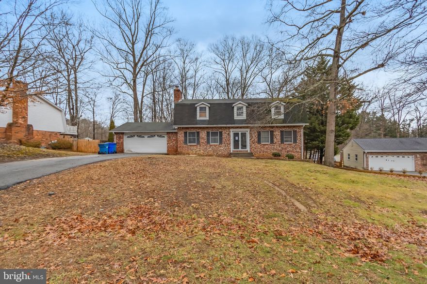 Discover this charming detached Dutch Colonial with a brick exterior, set on a nearly half-acre lot. Boasting a 2-car garage and a spacious driveway, this home offers both curb appeal and practicality. Inside, you'll find 4 generous bedrooms and 2.5 baths, along with an unfinished basement that provides endless potential for expansion. Enjoy outdoor living on your private deck—perfect for relaxing or entertaining. This property is a must-see! This property is now under auction terms. All bids will be subject to seller approval (minimums may apply). To help visualize this home’s floorplan and to highlight its potential, virtual furnishings may have been added to photos found in this listing.