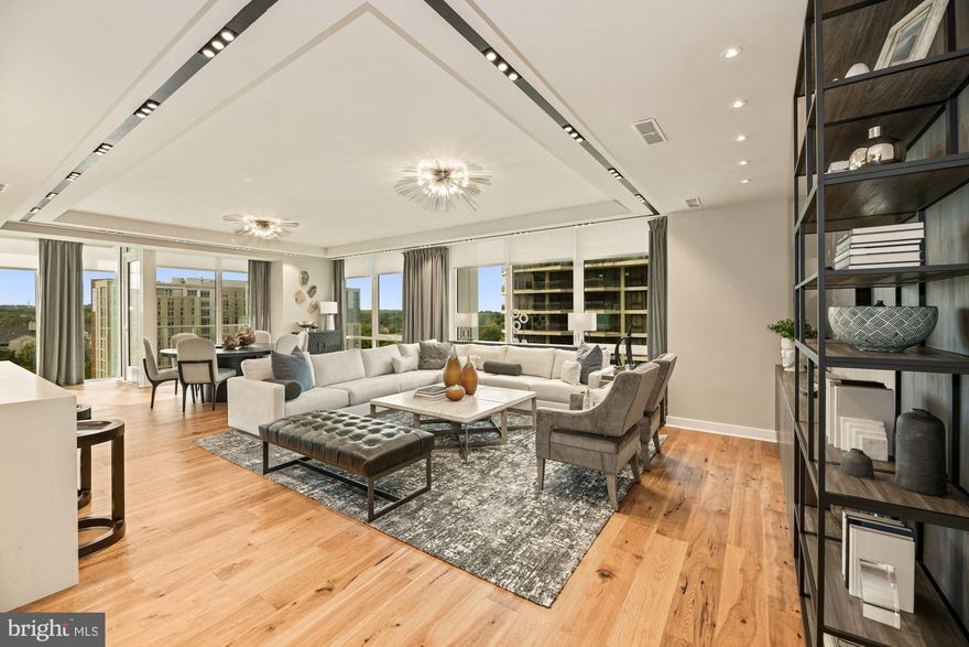 Welcome to Pierce, Arlington's most premier address!  This rarely available 3 bedroom/2.5 bath home with over 2400 sq ft and a private balcony is the siganture floorplan in the building.   Take the elevator directly into this open floorplan featuring three sides of  floor to ceiling windows. Top of the line chef kitchen featuring Thermador appliances, gas cooking, dual zone wine fridge, 7 inch hand scrapped hickory flooring, Snaidero cabinets and Quartz countertops with double waterfall islands. Stunning master bath with heated flooring, Bardiglio marble, Brizo faucets and spa inspired glass showers. 2 PARKING SPACES PLUS ON FLOOR STORAGE! The building amenity package is second to none featuring true white glove concierge services 24/7, double level fitness center, 2 level 27th story rooftop club room with outdoor dining and swimming pool with some of the best views in the entire region.  Unsurpassed location with everything you need within a short walk but yet a private neighborhood setting is the best of both worlds.