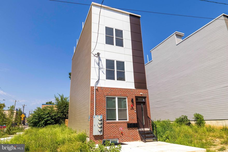 Introducing 660 N Brooklyn St, an exceptional new construction triplex that sets a new standard for design-forward living in Haverford North—one of West Philadelphia’s most exciting and rapidly evolving neighborhoods. Ideally positioned just minutes from UPenn, Drexel, CHOP, and the world-class institutions of University City, this striking property is surrounded by a landscape of dynamic growth and new development, offering a rare opportunity to invest in a premier urban location. Thoughtfully designed and constructed, the triplex features three distinct, separately metered residences, each with its own unique layout and appeal. The main and lower level boasts a spacious three-bedroom, three-bath bi-level residence, while the middle floor is dedicated to a contemporary two-bedroom flat. The upper bi-level residence features two bedrooms and two baths, crowned by direct access to an expansive private rooftop deck—an outdoor retreat with panoramic city views that truly elevate the living experience.
Throughout each residence, elevated finishes and refined details abound. Wide-plank luxury vinyl flooring, striking two-tone European-style cabinetry, quartz countertops with waterfall edges, and sophisticated matte black fixtures create an atmosphere of understated luxury. Modern tilework, custom vanities, and in-unit laundry add convenience and style, while intelligently designed layouts maximize both privacy and flow. The exterior makes a bold architectural statement, pairing brick, fiber cement, and metal cladding for a sleek, contemporary façade. The building’s rooftop deck provides unobstructed vistas of the Philadelphia skyline, adding significant appeal for both residents and investors alike. From an investment perspective, 660 N Brooklyn St delivers impressive fundamentals, with a projected rent roll of $66,000 per year, annual taxes currently just $775 thanks to a 10-year tax abatement, and estimated expenses of $3,325 per year—yielding a projected cap rate of 7%. Whether you are an investor seeking robust, predictable returns, or an owner-occupant interested in house-hacking by residing in one unit and renting the others, this property offers an outstanding combination of cash flow, prime location, and long-term upside in one of Philadelphia’s most promising corridors.