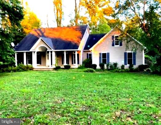 Welcome to 29209 Glencoe Road, a 1.5 acre paradise located in a beautiful setting at Glencoe Estates near the Sassafras River. Friendly, family-oriented Kentmore Park with a country feel and just a short drive to water access and the Chesapeake Bay! This custom built home offers spacious rooms with cathedral ceilings, hardwood floors, marble fireplace, custom built shelving and so much more. Primary Bath includes walk-in shower and jacuzzi tub with cherry double vanities. All 3 full bathrooms completely in ceramic tile. Stunning cherry cabinets and granite counter tops in Kitchen with stainless steel appliances and ceramic tile backsplash. Sliding glass doors open to a deck off the third bedroom. Numerous windows for light! Dry-walled garage, large basement that opens to the backyard with an additional bedroom and bath. Primary Bath has oversized walk in closet. A whole house generator! It's an easy commute to Middletown and shopping. Boating, hunting, fishing and relaxation, this home has it all; paradise on Maryland's Eastern Shore!