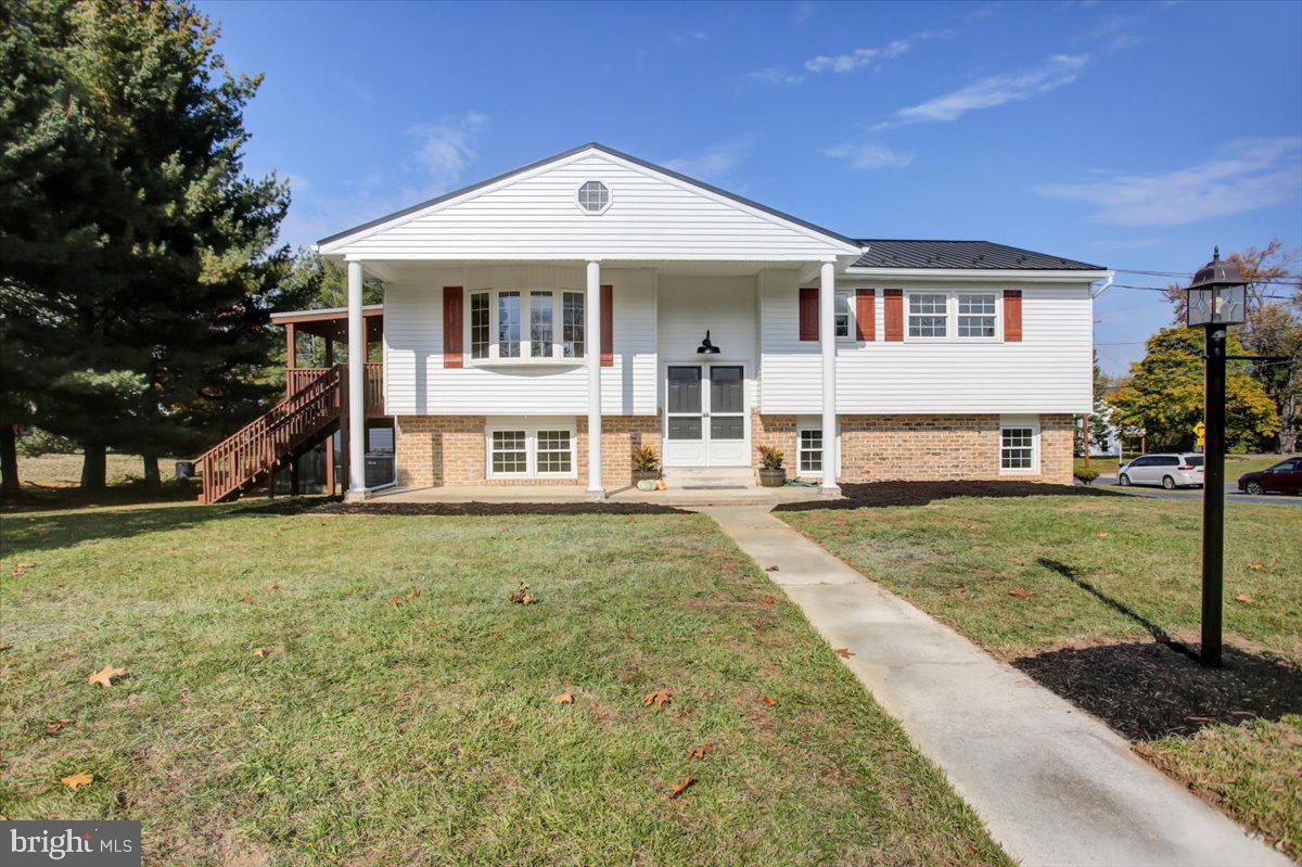 Welcome to 5 Cumberland Drive where you'll find a remodeled home with 4 bedrooms, 2 full baths, a third of an acre, 2 car garage and additional indoor and outdoor living spaces for you to enjoy!  As soon as you enter from the large porch and head to the upper level, you'll see an open floor plan with a brand new kitchen open to the dining and large living room.  From the dining area, exit through the sliding glass door to a spacious deck!  As you head back the hallway, you'll see a remodeled full bathroom with a tiled tub and shower combination along with 3 bedrooms.  One bedroom has laundry hookups available if you'd prefer.  Additional laundry hookups are in the drywalled and heated garage space downstairs.  Speaking of downstairs, you'll find a gorgeous, second living/family room complete with brick fireplace and propane insert.  The fourth bedroom and second full bath are also located downstairs making it a convenient primary or in-laws space with a private entrance.  As visually appealing as this home may be, it gets even better knowing the metal roof and heat pump are also brand new!  Make your move quickly and you could be eating Christmas dinner in this beautiful new space!  Call today for your own private tour.