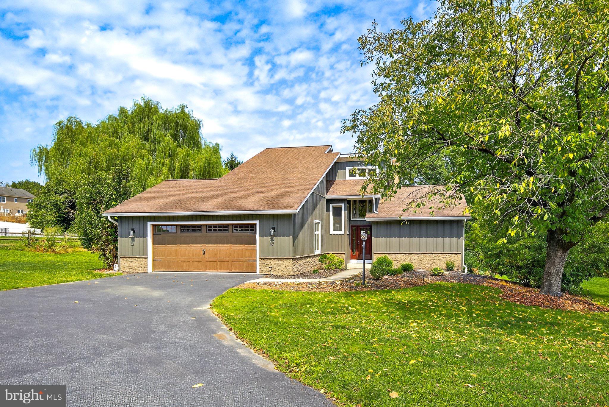 Every so often, a home comes to market that feels truly one-of-a-kind—this is that home. With its bold contemporary style blended seamlessly into a peaceful country setting, this property is a rare find in Lampeter-Strasburg. From the moment you arrive, the striking newly updated façade—complete with modern siding and stonework—sets the tone for what’s inside: a masterful transformation.
Step into the heart of the home, where a fully renovated kitchen awaits with rich cabinetry, strong and stylish countertops, a backsplash that doubles as artwork, and sleek stainless steel appliances. The open-concept design soars with two-story ceilings, exposed beams, and a dramatic brick gas fireplace, creating a space that is both breathtaking and inviting.
The first-floor primary suite is a sanctuary of its own, featuring skylights, a walk-in closet, a walk-in tiled shower and direct access to the screened-in porch. Every bathroom has been thoughtfully upgraded with county-chic vanities, while nearly every room boasts luxury vinyl plank or tile flooring for style and durability.
With its 2-car garage, generous driveway for guests, first-floor laundry, and an ideal location close to major highways, this home is as practical as it is stunning. The lot itself adds to the appeal, giving you the tranquility of the countryside while keeping conveniences within easy reach.
This home has undergone a remarkable evolution—what once was ordinary is now extraordinary. Contemporary flair, country charm, and quality updates blend into something you simply won’t find every day.
Don’t miss your chance to experience this rare gem. Schedule your showing today—homes like this don’t stay available for long.