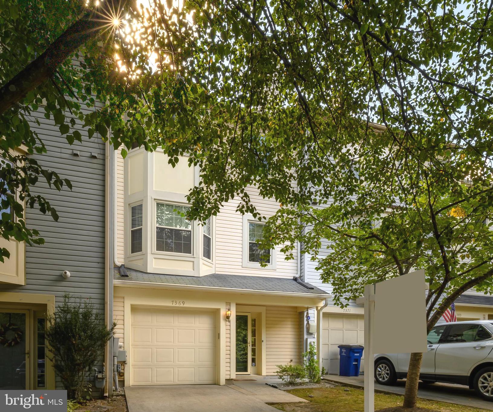 Welcome to 7369 Eden Brook Drive, a beautifully maintained townhome located in the desirable Village of Kings Contrivance in Columbia. This spacious residence offers nearly 2,000 square feet of thoughtfully designed living space, complete with a private driveway, attached garage, and a fenced backyard that backs to tranquil woods, creating a serene and private retreat.
Step inside to a bright and welcoming foyer with hardwood floors and convenient access to the garage and laundry room. The entry-level features a generous family room with a newly updated full bathroom perfect for entertaining, private bedroom, office or recreation room with direct access to the backyard.
On the main level, you’ll find a stunning family room with a bay window, a wood-burning fireplace, a stylish open dining area and a powder room. The updated kitchen is a true highlight, featuring granite countertops, a butcher block island, and a charming breakfast nook with access to the deck overlooking the backyard. The Trex deck and fenced yard offer a perfect space for summer grilling, play, or simply enjoying the natural setting.
On the upper level, you'll find two spacious bedrooms and two full baths, including a primary suite that feels like a true retreat with vaulted ceilings, a walk-in closet, and a generous ensuite bath. Just a few steps up from the primary bedroom is an incredible private loft featuring skylights and a cozy second fireplace. Whether you envision a stylish home office, a peaceful reading nook, a playful nursery, or your own personal yoga sanctuary, this bright and versatile space is full of possibilities and charm.
Tucked away on a quiet street yet conveniently close to major commuter routes, shopping, restaurants, and scenic trails, this home offers the perfect balance of comfort, design, and location. Don’t miss the opportunity to make this thoughtfully updated townhome your own.