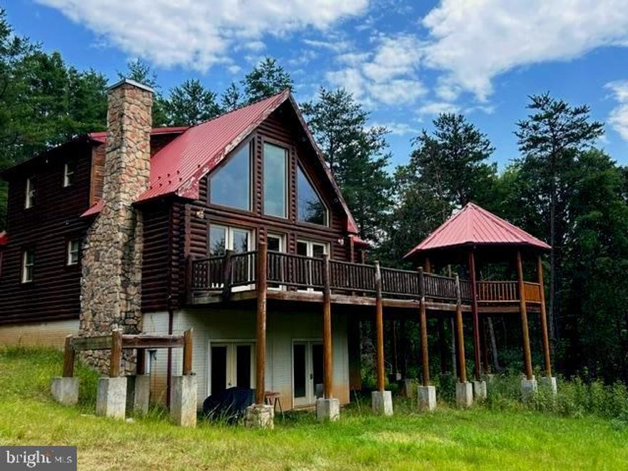 This property is nestled in the forests of Ashton woods-- a private gated community. With a log exterior, the house seemingly blends into the nature around it. The scenery can also be enjoyed on the gazebo attached to the deck. On the inside, there are three bedrooms and three bathrooms.  The wooden interior is complimented by stripped logs and an open fireplace with a stone hearth that can be seen from the loft. Downstairs is the unfinished basement with a bathroom, and a lot of potential.

Homeowners can enjoy hiking, hunting and mountain-biking on the 20.2 acre premise with a meadow and pond. And if you're so adventurous, other outdoor attractions are still within driving distance, including Spruce Knob, Seneca Rocks, Dolly Sods and the George Washington National Forest. 

With some love and work, this property can become a dream home.

3 bed 3 bath