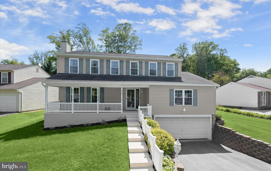 Set within the Canbury Woods community in Howard County, this beautifully maintained colonial offers extensive updates, thoughtful design, and a setting that balances comfort with convenience. A landscaped front yard and covered front porch create an inviting first impression, setting the tone before stepping inside.
The foyer introduces the home with classic box wainscoting and leads directly into a fully renovated kitchen that serves as the heart of the main level. Designed with both function and detail in mind, it features upgraded cabinetry with specialty inserts for baking sheets and spices, soft-close drawers, granite countertops, a breakfast bar, prep sink, planning station, and casual dining space. High-end JennAir appliances include a commercial-grade refrigerator, double wall ovens, and an induction cooktop. A walk-in pantry and adjacent laundry area with utility sink add everyday practicality.
Just beyond the kitchen, a sliding glass door opens to a sunroom reimagined in 2026 with slate tile flooring, vaulted ceilings, skylights, fresh paint, a new back door, and a mini split system for year-round comfort. Off the kitchen, the expansive family room offers warmth and character with a coffered ceiling, while hickory hardwood flooring flows seamlessly through the main level, including the formal living and dining rooms. A half bath completes this level.
Upstairs, newly replaced carpeting leads to a spacious primary suite featuring a built-in vanity, walk-in closet, and an updated en-suite bath with a floor-to-ceiling tiled shower and luxury vinyl plank flooring. Three additional bedrooms share a well-appointed hall bath with a jetted soaking tub.
The lower level expands the living space with a recreation room, a media room with French doors, a full bath, and garage access, offering flexibility for entertaining or everyday living.
Outdoor living is equally well designed with a fenced backyard, a rebuilt rear deck featuring Trex composite decking, and a paver patio with built-in firepit, all framed by mature landscaping and hardscaping that enhance privacy and usability.
Significant updates provide peace of mind, including a Carrier Infinity HVAC system (2011), kitchen renovation and hardwood flooring installation (2013), GAF Lifetime roof (2016), reconstructed front porch and new washer and dryer (2024), and extensive 2026 upgrades throughout the sunroom, primary bath, deck, and second floor carpeting.
The home offers exceptional convenience near Arundel Mills, dining, shopping, parks, the BWI Trail system, and major commuter routes including Route 100, I-295, and I-95, with easy access to Columbia, Baltimore, Annapolis, Washington, D.C., and BWI Airport.