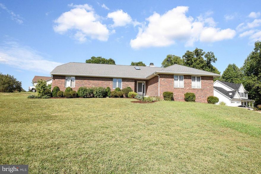 Home Sweet Home! Well maintained brick front rambler  situated on just over .5 acres. Open Floor Plan....3 BR & 2 full baths. 2 story wood burning FP between dining rm & great rm. Great rm w/vaulted ceilings & doors to patio. Master BR w/WIC, doors to backyard & lux bath w/soak tub, dble sink & sep shwr. 2 car garage. Great location, close to shopping & dining! This one won't last long...