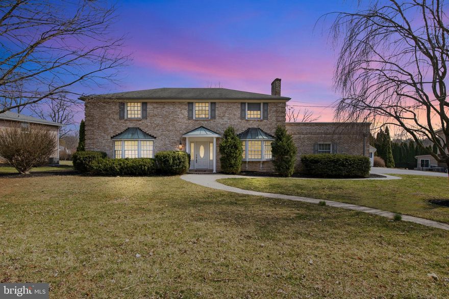 This stunning 1970's quality all brick two- story Colonial is perfect for anyone seeking a blend of elegance, and comfort.  Located in the sought after Dallastown School District Marlborough West development. 4 spacious bedrooms and 3.5 full baths.   As you step through the grand entrance, you are welcomed by a spacious marble foyer with curved staircase that sets an inviting tone for the rest of the home. The first floor boasts hardwood floors, a cozy brick fireplace with built in shelving.  The heart of this home the kitchen features generous workspace, cherry cabinetry & quartz counter tops.  Cooking and hosting will become a joy rather than a chore!  The back of the home features a large sunroom drenched in natural light, overlooking the rear yard with deck, patio and 20x40 inground pool, perfect for relaxing or entertaining!  The lower level offers and long rec room with wet bar, full bath, exercise room, utility room, cedar closet, and bonus room with endless possibilities.  This timeless home blends classic craftsmanship with some modern updates- schedule your showing today!