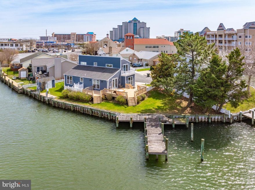 Welcome to your coastal retreat! Perfectly positioned on a waterfront point lot at the end of a private cul-de-sac, this detached single-family home is all about relaxed beach living and breathtaking open water views in every direction. Imagine starting your mornings with coffee on the deck as the sun sparkles across the canal, and ending your evenings with colorful sunsets reflecting off the water along your 140 feet of bulkhead. Launch your boat or paddle board from the step-down dock and be cruising the open bay in minutes. There is also space for 2 jet skis. Inside, thoughtful updates bring comfort and style: HVAC (2020), siding and windows (2017), luxury vinyl plank flooring (2014), Deck (2005), Bulkhead/Dock (2013) and beautifully organized California Closets (2014). After a day in the sand, rinse off in the convenient outdoor shower and settle into easy coastal living. Location truly shines here—just three blocks to the beach and boardwalk, and an easy stroll to restaurants, shopping, and all the fun Ocean City has to offer. Whether you’re looking for a year-round residence, vacation escape, or investment opportunity, this home delivers the best of waterfront and beachside living. The seller is offering a 3% credit to the buyer.