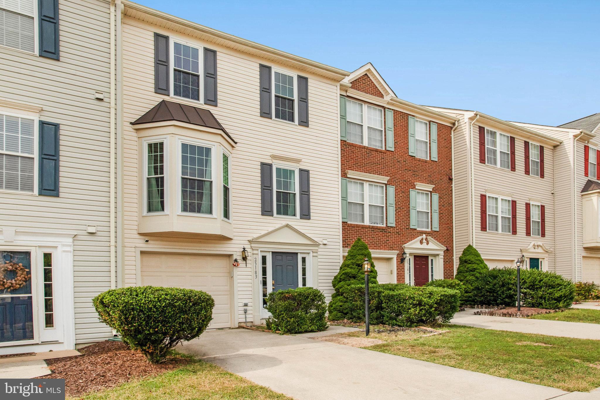 Welcome home! This lovely townhome offers an open layout and light-filled spaces on all three levels. On the main level, you’ll find a beautiful bay window flooding the living room with abundant natural light, with plush carpeting under your feet and a bonus nook perfect for a home office or play area. On the back of the home, the expansive eat-in kitchen features plenty of cabinet space, with a central island and an additional wall of cabinetry in the dining area. Upstairs, the generously-sized primary bedroom suite boasts a large walk-in closet and a private en suite bathroom with a double sink vanity. Two additional bedrooms are sizable, with soft carpeted flooring and shared access to the second full bathroom in the hallway. Downstairs on the entry level, you’ll find a large storage room and garage access, plus a convenient powder room. Outside, the wide deck overlooks open common space, creating a peaceful and private setting for morning coffee or outdoor dining. On the front of the home, the attached garage and driveway offer you plenty of space for both storage and convenient parking. Enjoy fantastic neighborhood amenities including an outdoor pool, tennis courts, basketball courts, a community center, and open common grounds. All this, plus a prime location close to major commuter routes, shopping, and dining. Schedule a private tour of your new home today!
