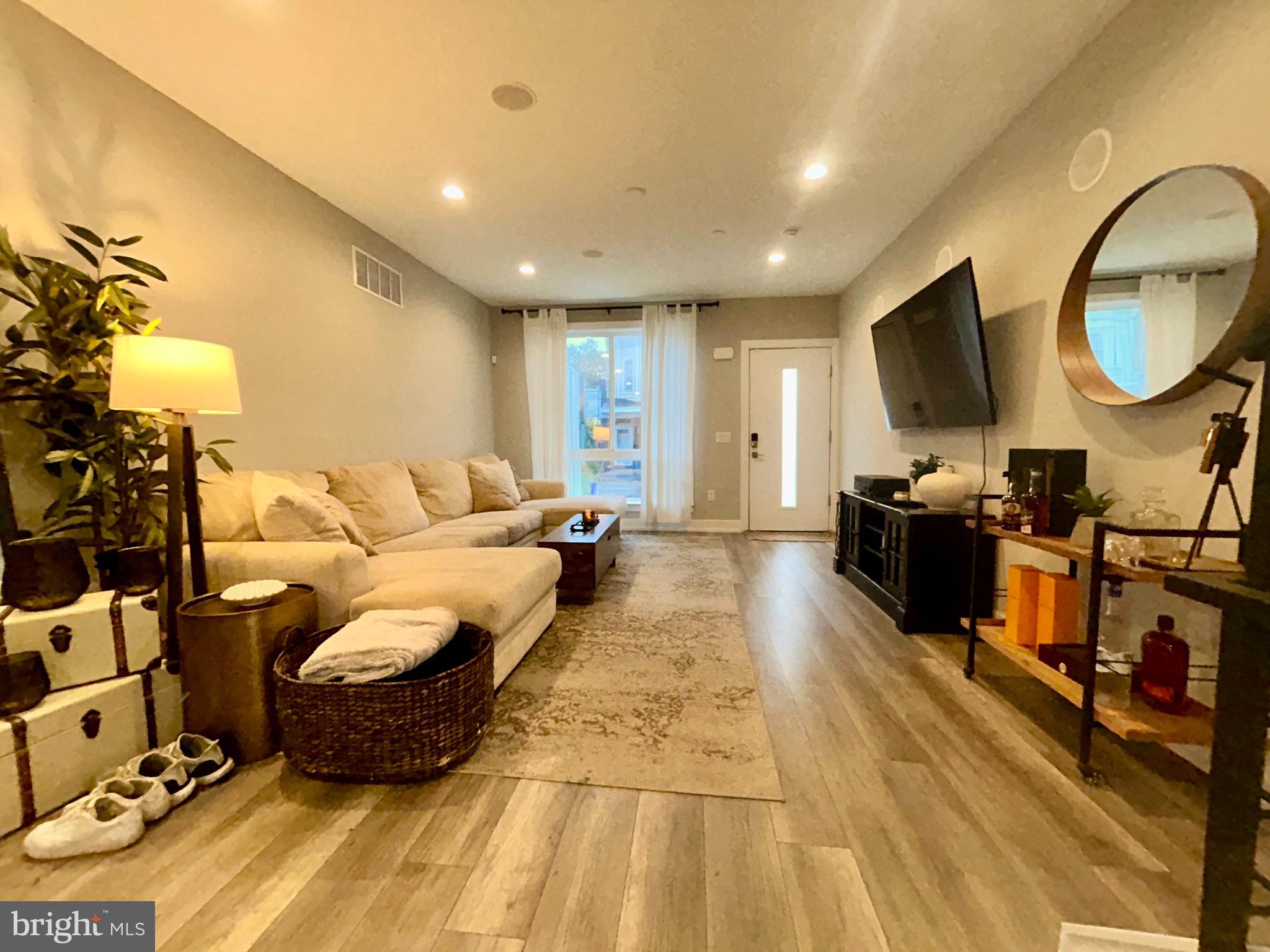 ***Discount to be considered with any lease executed before 6/15***
Welcome to this oversized luxury property in Brewerytown. 5 bedroom, 3.5 bathroom home that blends space, style, and smart convenience. The biggest property on the lot at over 15 feet wide with soaring 10 foot ceilings. Step right in to the spacious living room and open-concept living space, equipped with a surround sound speaker system. The kitchen is thoughtfully designed with quartz countertops, upgraded GE appliances, gas range stove and plenty of storage space. Powder room and pantry closet off the kitchen. The kitchen opens to a private backyard oasis. Perfect for entertaining and grilling year round. The second level offers two spacious bedrooms, each with a walk in closet and can fit king beds. This level also has a full bath with shower/tub, towel closet and full laundry room. The third level offers the primary suite with a walk in closet and private bathroom. The bathroom has a double vanity and a rain shower. Also on this level is an additional bedroom with walk in closet (as shown as an office), and a full wet bar! Walk up the stairs to the best feature of this home. The rooftop boasts views of center city and the art museum. This property is the tallest on the block so you enjoy privacy on the roof deck. The roof deck comes equipped with a speaker system, perfect for entertaining. The basement is massive and has a full bath, walk-in shower, and 3 large in closets. Double doors lead into the main room. Turn this basement into a private suite! The property sits on a wide residential street with ample parking for you and your guests. Smart home thermostats, keyless entry, and so much closet space throughout. This home truly has it all.
Virtual tour available upon request. Available for move-in starting June 7th. Contact Shane Yaller for showing details