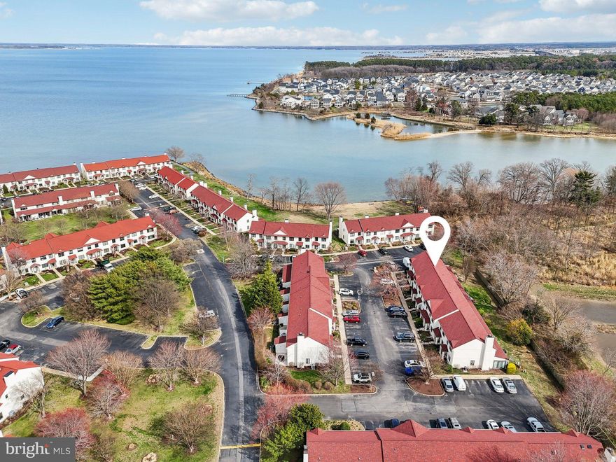 Tucked inside the sought-after Queens Landing community, this beautifully maintained townhome delivers the space, layout, and low-maintenance lifestyle everyone loves, plus a rare private setting with no traffic behind the home. Step inside to an open, airy main level featuring luxury vinyl plank flooring throughout the living area and an easy flow that is perfect for everyday living and entertaining.

The kitchen features bright white shaker-style cabinetry, updated approximately three years ago, sleek quartz countertops, and a lineup of appliances that have been replaced in recent years, including the stove, dishwasher, and washer. A front-load washer and dryer on the main level add extra convenience, and a powder room completes the first floor. 

Upstairs, you will find three bedrooms with wall to wall carpet for that cozy feel. The primary suite offers a vaulted ceiling, a quiet retreat vibe, and an en-suite full bath with a walk in shower. The second full bath is located in the hallway with direct access for both additional bedrooms, making the upstairs layout functional and guest friendly.  

The screened porch is a wonderful bonus space, finished with tile flooring and offering approximately 160 square feet to enjoy morning coffee or evening downtime. It also provides future potential to convert to a four season room for added conditioned living space. A dedicated storage closet off the porch is perfect for bikes, beach gear, and seasonal items. The roof has been replaced in recent years with 30-year architectural shingles, and the seller is offering a one-year home warranty for added peace of mind. 

Queens Landing is known for its charming coastal vibe, resort-style feel, and convenient location close to Kent Island shopping and dining, plus quick access to Route 50 for commuters and weekend escapes. Community amenities include an in-ground, heated waterfront pool, fitness center, pickleball and tennis courts, and a walking path along the Chester River. Move-in ready, thoughtfully cared for, and set in a peaceful spot within a favorite community, this one checks the boxes.