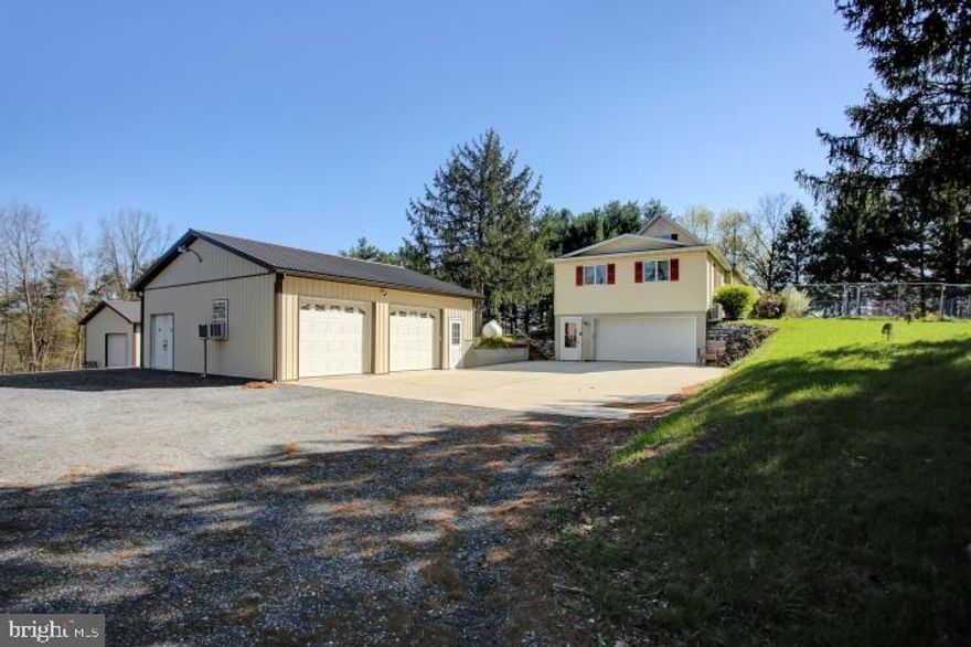 Possession not until June 7th.  Charming Cape Cod on 6 wooded acres with plenty of room to relax and space to play.  Welcome to this spacious 3 bedroom, 2.5 bath home tucked away on a peaceful 6 acre wooded lot.  With large rooms throughout and a huge living, this home offers both comfort and space for relaxing or entertaining.  A fully finished basement with a functional kitchen and full bath with walk-in shower is perfect for guests, in-laws, or even potential rental income.   Handicap chair lift installed from 1st floor of home to the basement.  The home sits 250 feet off the road, accessed by a private, tree lined driveway, offering seclusion and a picturesque setting.  Outside, the property features a  24x30 pole barn ideal for storing tractors, lawn equipment, and tools.  There's a 30x30 insulated outbuilding with heating and air conditioning, set up for entertaining, including a kitchenette, a large workshop, or other creative uses.  Both building were built between 2021 and 2022. (The owner may open to selling some of the appliances and equipment within the buildings.)  Additional highlights include large chicken coops, a secluded one room cabin nestled at the back of the property and wooded paths perfect for golf cart access.  A rare find that combines comfort, privacy, and versatility.  Don't miss the opportunity to make this unique property you own!