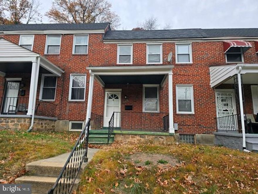 3-bedroom, 1.5-bath brick townhome featuring hardwood floors throughout. This home offers a front porch, a partially finished basement with additional storage potential, and is located directly across from Druid Park. Perfect for buyers seeking convenience and classic character.
