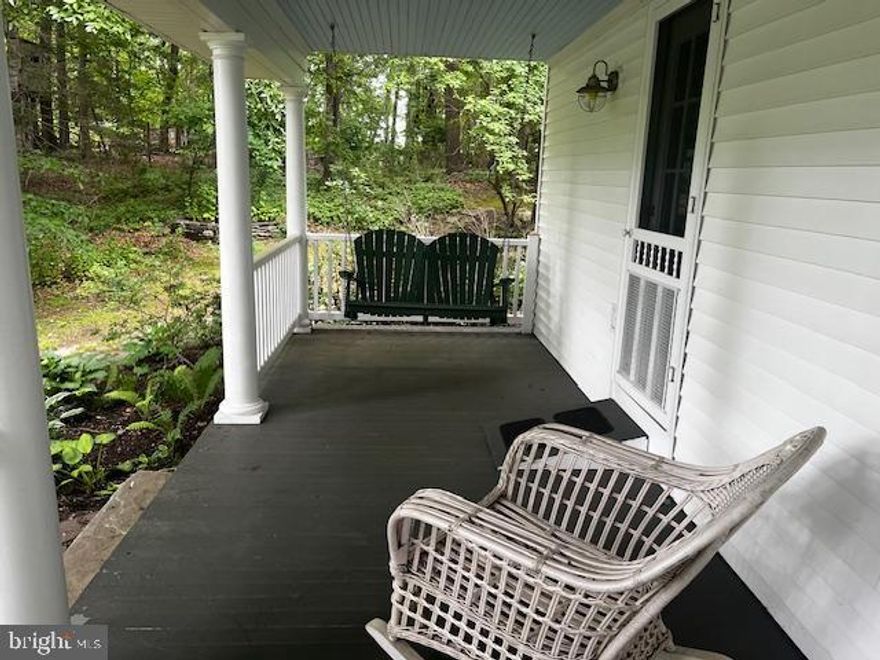 Tucked away on a peaceful cul-de-sac, this 4-bedroom, 2.5-bath home offers timeless charm and thoughtful updates. A full-width wrap-around porch with durable teak decking and Spanish cedar railings.  Inside, the spacious layout features hardwood floors throughout the main level, a sun-filled dining room, and a beautifully updated custom kitchen (2011) with granite countertops, lighted cabinetry, a large center island, and a built-in desk.  Upstairs, the primary suite includes hardwood floors, a walk-in closet, and a spa-inspired bath with Carrara marble, glass shower doors, and upscale finishes. Three additional bedrooms offer generous closet space, bright natural light, and an updated hall bath with modern details.  Additional highlights include a partially finished basement with ample storage, an attached two-car garage, and mature landscaping. Ideally located close to shopping, major highways, Hibernia Park, and Brandywine Creek.
