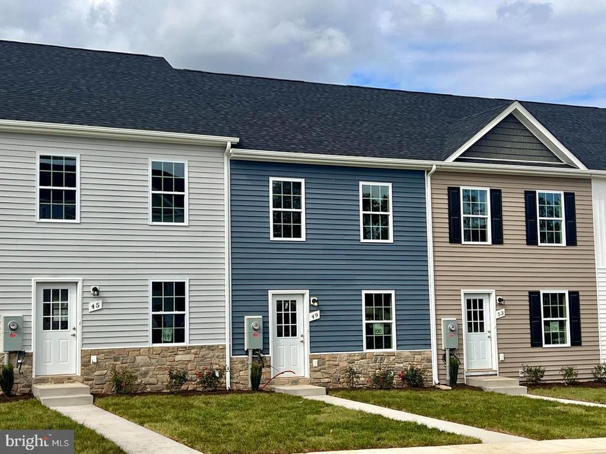 Dark blue and stone: what a great look! 3-Story Townhome for Immediate delivery. Located next to the Jefferson County Line but with Berkeley County prices! End units available! Builder offering 3% ($8550 on this one) in closing costs! 3-story townhouse with 3 beds, 3.5 baths, and 1,944 sqft. Middle level features family room, kitchen, dining area, laundry room, half bath, and pantry. Upstairs has 2 primary bedrooms with en-suite bathrooms and walk-in closets. Basement includes a 3rd bedroom with walk-in closet and full bath, a large rec room, and ample storage. Home has granite countertops, soft-close cabinets, LVP flooring in living area, carpet in bedrooms, walk-in shower in primary bedroom, and a walk-out basement.

Awesome value and great floorpan!