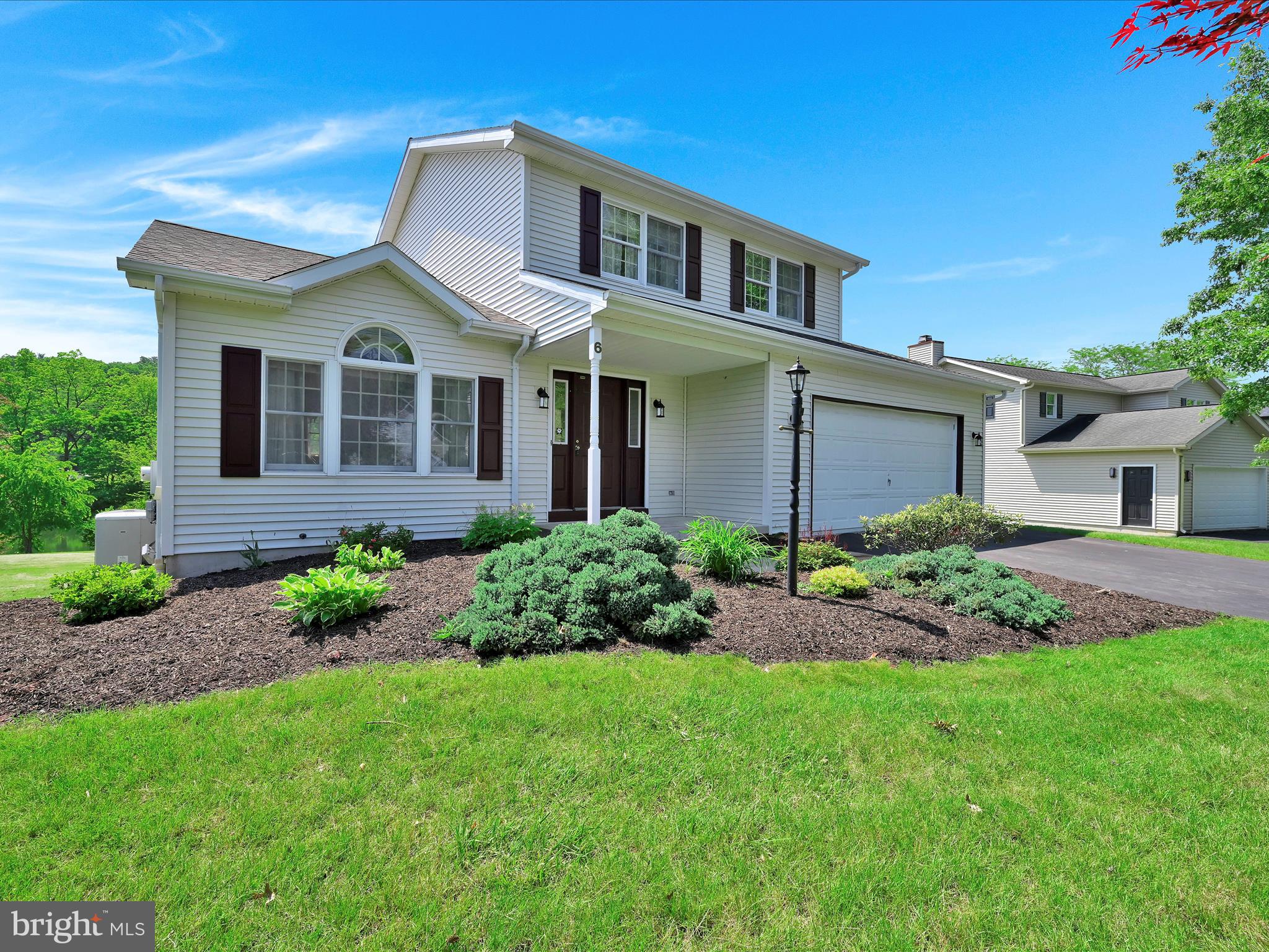 Welcome to this charming 3-bedroom, 2.5-bath home nestled on a desirable level lot in Chestnut Hill, within the highly sought-after Blue Mountain School District. Enjoy tranquil pond views from your new home, offering a serene backdrop to everyday living. Step inside to discover a refreshed interior. The first floor boasts European-inspired tiled flooring, leading to a nicely appointed kitchen featuring granite countertops. This open-concept space flows seamlessly into a large family room, perfect for entertaining and creating lasting memories. The owner suite offers a private retreat with its own en-suite bath, complete with a walk-in shower. Two additional bedrooms and a second full bath with a tub/shower provide ample space and convenience. Recent upgrades enhance this home's appeal, including a brand new roof, ensuring peace of mind for years to come, and a new composite deck off the family room, ideal for outdoor enjoyment and taking in those picturesque pond views. All your storage needs are covered with the full walk-out basement. The exterior also benefits from refreshed landscaping, adding to its curb appeal, while a fresh coat of paint throughout the interior gives the home a bright and inviting feel. A two-car garage completes this property.
