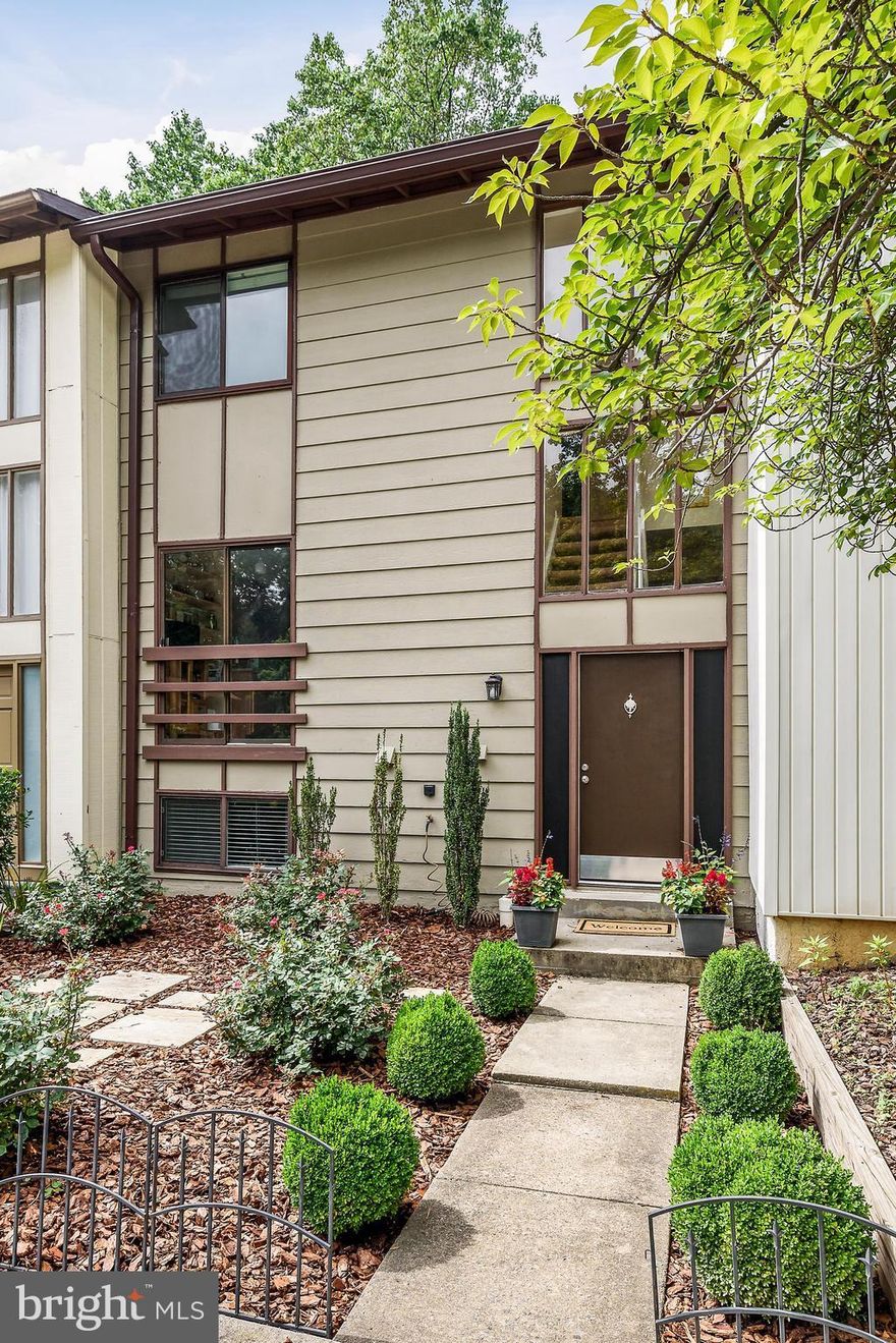 Incredible value for fully renovated town-home in the heart of Reston.  Newer roof, newer windows, newer HVAC, 3 generously sized bedrooms with Den/Pos 4th BR on lower level, fully finished basement w/ walk out, granite/stainless kitchen, hw floors on main, backing to woods & beautiful rear deck.  Close to Reston Town Center, Reston Metro & all Reston has to offer. 2 assigned spots right in front!