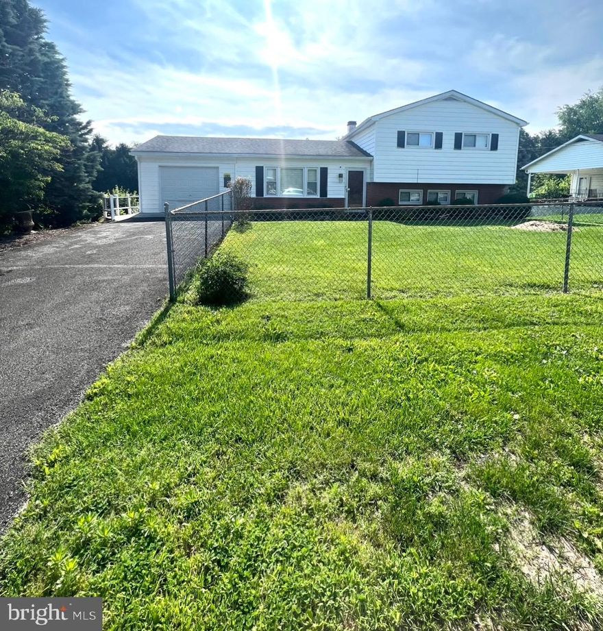 This cozy, split-level home nestled in the heart of Charles Town consists of hardwood floors and updated flooring, granite countertops, stainless steel appliances and kitchen sink, beautiful crown molding character, and updated shutter blinds throughout the home. Newly installed heating and air system, along with new hot water tank and circuit breaker all installed in 2022. Outside of the home features a fenced in front yard and larger, beautiful back yard with a concrete porch attached to the back of the home to sit back and relax in privacy. There's also plenty of storage space with an attached garage and a shed in the backyard that conveys. Don't miss out on this lovely home, schedule your showing today! ( Professional photos coming soon)