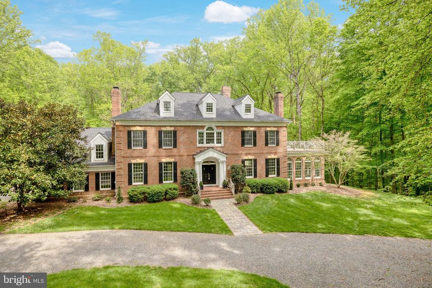 This custom all-brick estate situated on 5 acres and  surrounded by River Bend Park, provides both privacy and unparalleled access to the Potomac River and its  abundance of trails and activities.  Offering understated elegance showcasing volume ceilings, hardwood floors on main and upper levels, five wood-burning fireplaces, this 5 bedroom and 5 bath home also features a four-seasons room , which present serene pastoral views throughout the year. Retreat upstairs to the large owner's suite  to relax on the large private deck or the newly-renovated spa-like bath with two large walk-in closets. The outdoor living space includes an idyllic screened porch and extensive decks, perfect for large gatherings and entertaining. Additionally, there is a  private rear-entrance to unfinished space above the garage with rough-in for a full bath, ideal for au-pair suite or home office.  Don't miss out on this one-of-a-kind home in the heart of Great Falls!